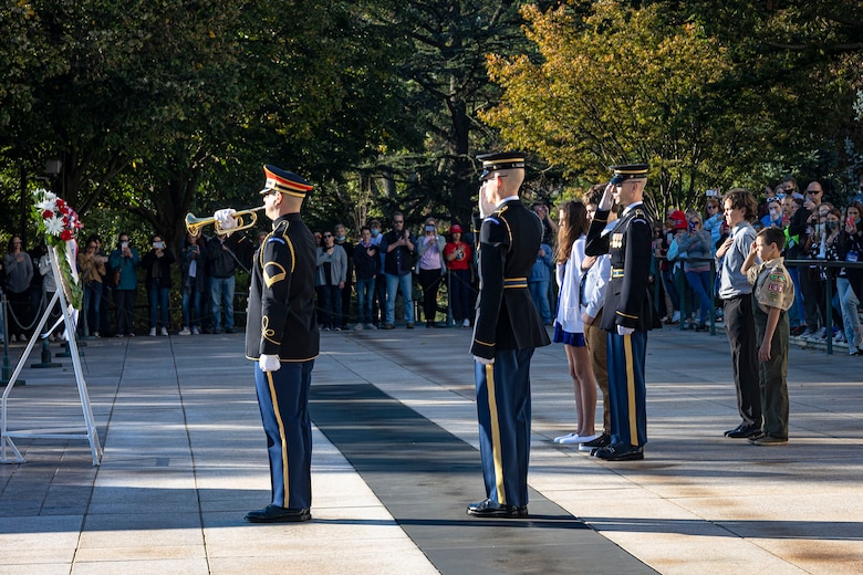 Sentinels from the 3rd U.S. Infantry Regiment render honors during a bugle call of Taps at the Arlington National Cemetery’s Tomb of the Unknown Soldier in Arlington, Va., Oct. 22, 2021. The bugle call of Taps has had a long association with Arlington National Cemetery. Today it is sounded at the many daily interments at Arlington and the Tomb of the Unknown Soldier when a wreath is presented in honor of the Unknowns by the many military, veteran, civic, fraternal, school, and other organizations that travel to Washington to pay homage. (U.S. Army photo by Greg Nash)