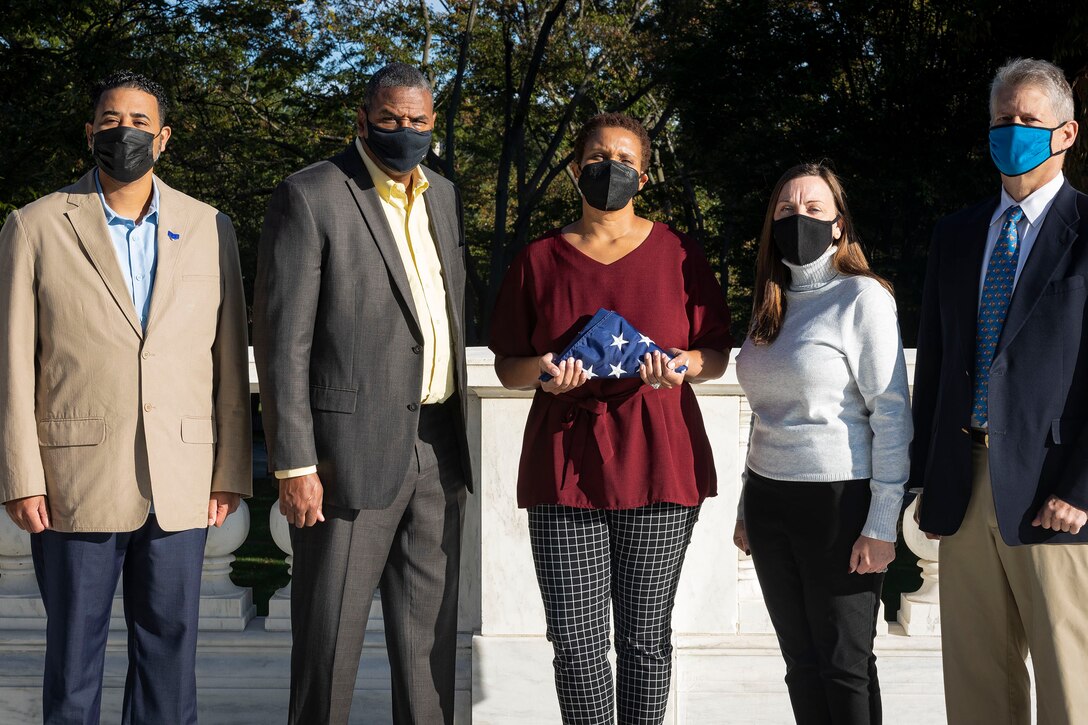 Military Veterans from the U.S. Army Corps of Engineers, Baltimore District, pay tribute at the Arlington National Cemetery in Arlington, Va., Oct. 22, 2021. USACE Baltimore District employees reflected on their military service and mourned the unidentified service members who perished in war, while visiting the cemetery and Tomb of the Unknown Soldier site. (U.S. Army photo by Greg Nash)