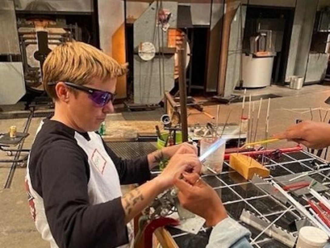 Staff Sgt. Stacy Englert, a Soldier assigned to the Joint Base Lewis-McChord Soldier Recovery Unit, Washington, learned to create artwork during a glass blowing class held at a museum on Sept. 27. This July, the class resumed after being on hold for 14 months due to the COVID-19 pandemic.