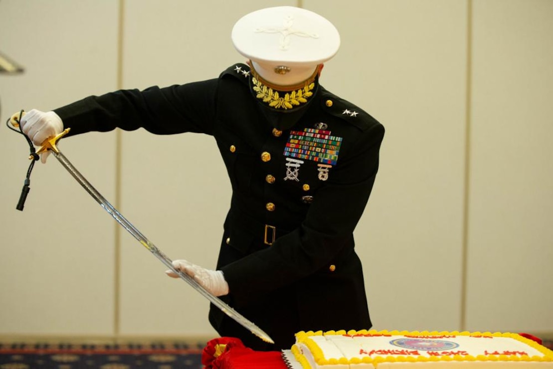 Major Gen. Jason Q. Bohm, Marine Corps Recruiting Command, Commanding General, cuts the cake during the Cake Cutting Ceremony for the 246th Marine Corps Birthday at the Clubs of Quantico, Marine Corps Base Quantico, VA, on November 4, 2021.The Cake Cutting Ceremony is an annual tradition representing an annual renewal of each Marines commitment to the Corps, and The Corps’ commitment to passing on knowledge and tradition from one generation to the next.