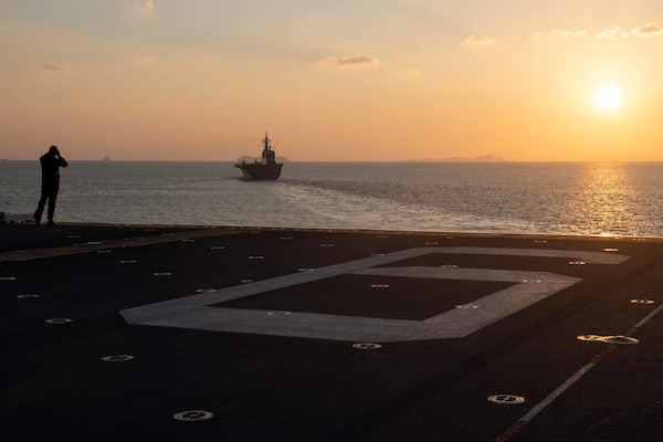 EAST CHINA SEA (Nov. 3, 2021) The forward-deployed amphibious assault ship USS America (LHA 6) sails in formation with the Japan Maritime Self-Defense Force ship JS Ise (DDH 182). America, lead ship of the America Amphibious Ready Group, is operating in the U.S. 7th Fleet area of responsibility to enhance interoperability with allies and partners and serve as a ready response force to defend peace and stability in the Indo-Pacific region. (U.S. Navy photo by Mass Communication Specialist 2nd Class Shelby Tucker)