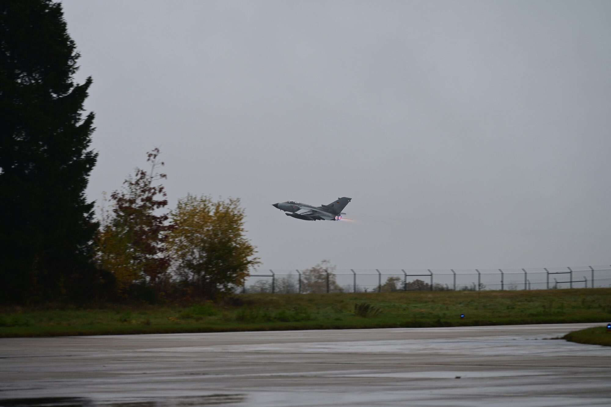 A German Air Force Tornado fighter jet takes off from Büchel Air Base, Germany, during Castle Forge, a MAJCOM-wide  Agile Combat Employment Initial Operating Capability event,  Nov. 4, 2021. Participation in multinational exercises like Castle Forge enhances our professional relationships and improves overall coordination with allies and partner militaries during times of crisis. (Courtesy photo by Dr. Sandeep Mulgund)