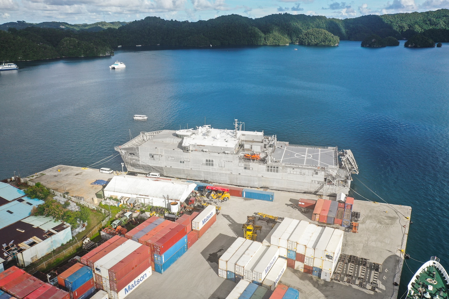 U.S. Military Sealift command's Spearhead-class expeditionary fast transport ship, City of Bismarck, floats while docked at the Commercial Seaport of Palau in Koror, Republic of Palau, Nov. 5, 2021. Military Sealift Command Far East ensures approximately 50 ships in the Indo-Pacific region, including City of Bismarck, are manned, trained and equipped to deliver essential supplies, fuel, cargo, and equipment to warfighters, both at sea and on shore. The ship is currently supporting Task Force Koa Moana 21, I Marine Expeditionary Force by transporting gear and personnel from California to the Republic of Palau. (U.S. Marine Corps photo by Cpl. Atticus Martinez)