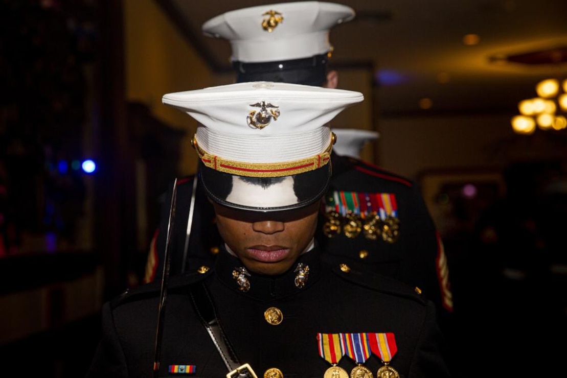 U.S. Marines with Bravo Company, Headquarters and Support Battalion, Marine Corps Installations Pacific, bow their heads in prayer as part of the color guard during a ceremonial ball celebrating the Marine Corps’ 246th birthday on Camp Butler, Okinawa, Japan, Oct. 28, 2021. Due to the COVID-19 pandemic, the service members of H&S Battalion had not celebrated the Marine Corps birthday ball since 2019. The USMC birthday ball is a celebration of tradition that represents where the Marine Corps started, where it is now, and allows a glimpse of the past, present, and future.