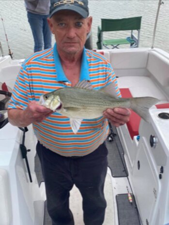 Retired U.S. Air Force Tech. Sgt. Terry Kratz poses with a fish he caught. Since retiring, Kratz spends most of his days golfing and doing other outdoor activities. (Courtesy photo by Gail Hargis)