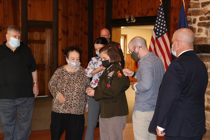 With the help of her family, Brig. Gen. Laura McHugh, deputy adjutant general - Army, Pennsylvania National Guard, was ceremoniously promoted to her current rank on Nov. 6, 2021, at Fort Indiantown Gap, Pa.  She was appointed as the deputy adjutant general - Army on April 1, 2021. (Photo by Lt. Col. Keith Hickox)