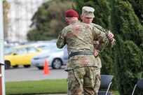 Maj. Gen. Jeffrey C. Coggin, commanding general, U.S. Army Civil Affairs and Psychological Operations Command (Airborne), welcomes Brig. Gen. Christopher J. Dziubek as commanding general, 351st Civil Affairs Command, during the change of command ceremony at the Sgt. James Witkowski Armed Forces Reserve Center, Mountain View, California, Saturday, Nov. 6, 2021.
