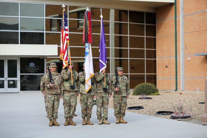 Soldiers of the 351st Civil Affairs Command render honors to the flag as the National Anthem plays at the change of command ceremony between Brig. Gen. Isaac Johnson, Jr., outgoing commanding general, and Brig. Gen. Christopher J. Dziubek, incoming commanding general, at the Sgt. James Witkowski Armed Forces Reserve Center, Mountain View, California, Saturday, Nov. 6, 2021.