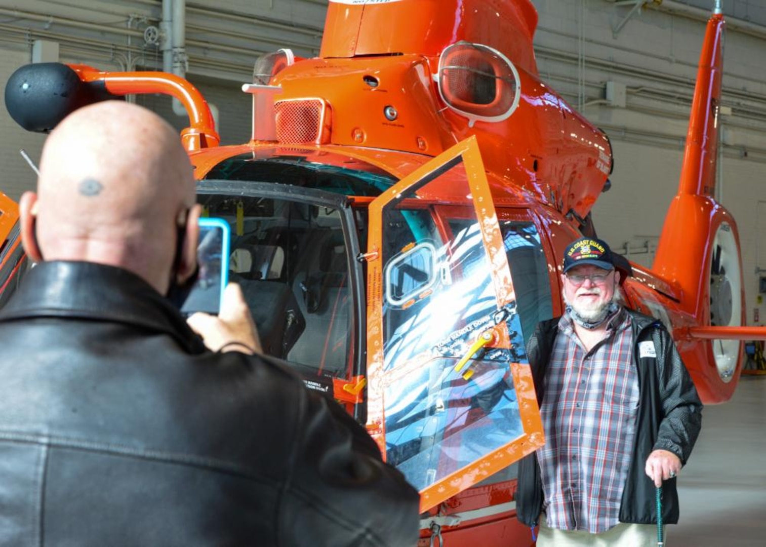 Bill Leggett, a Coast Guard Vietnam veteran, poses for a photo during a tour given to Coast Guard Vietnam veterans from the Coast Guard Cutter Owasco at Coast Guard Air Station Washington, Nov. 5, 2021. A Lexington, Ky., native, Leggett is a former 3rd class boatswain's mate aboard the cutter and was one of several veterans who was presented with an official lapel pin commemorating their service and for the 50th anniversary of the Vietnam War. (U.S. Coast Guard photo by Petty Officer 1st Class Tara Molle-Carr/Released)