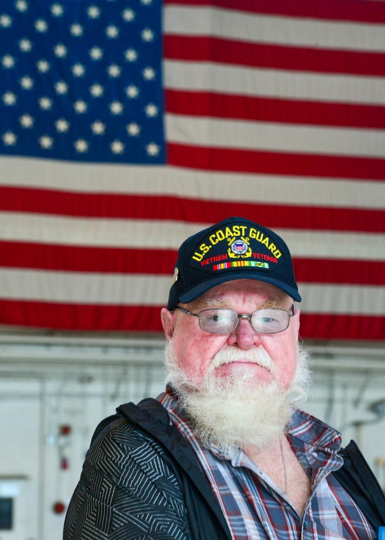 Bill Leggett, a Coast Guard Vietnam veteran, poses for a photo during a tour given to Coast Guard Vietnam veterans from the Coast Guard Cutter Owasco at Coast Guard Air Station Washington, Nov. 5, 2021. A Lexington, Ky., native, Leggett is a former 3rd class boatswain's mate aboard the cutter and was one of several veterans who was presented with an official lapel pin commemorating their service and for the 50th anniversary of the Vietnam War. (U.S. Coast Guard photo by Petty Officer 1st Class Tara Molle-Carr/Released)