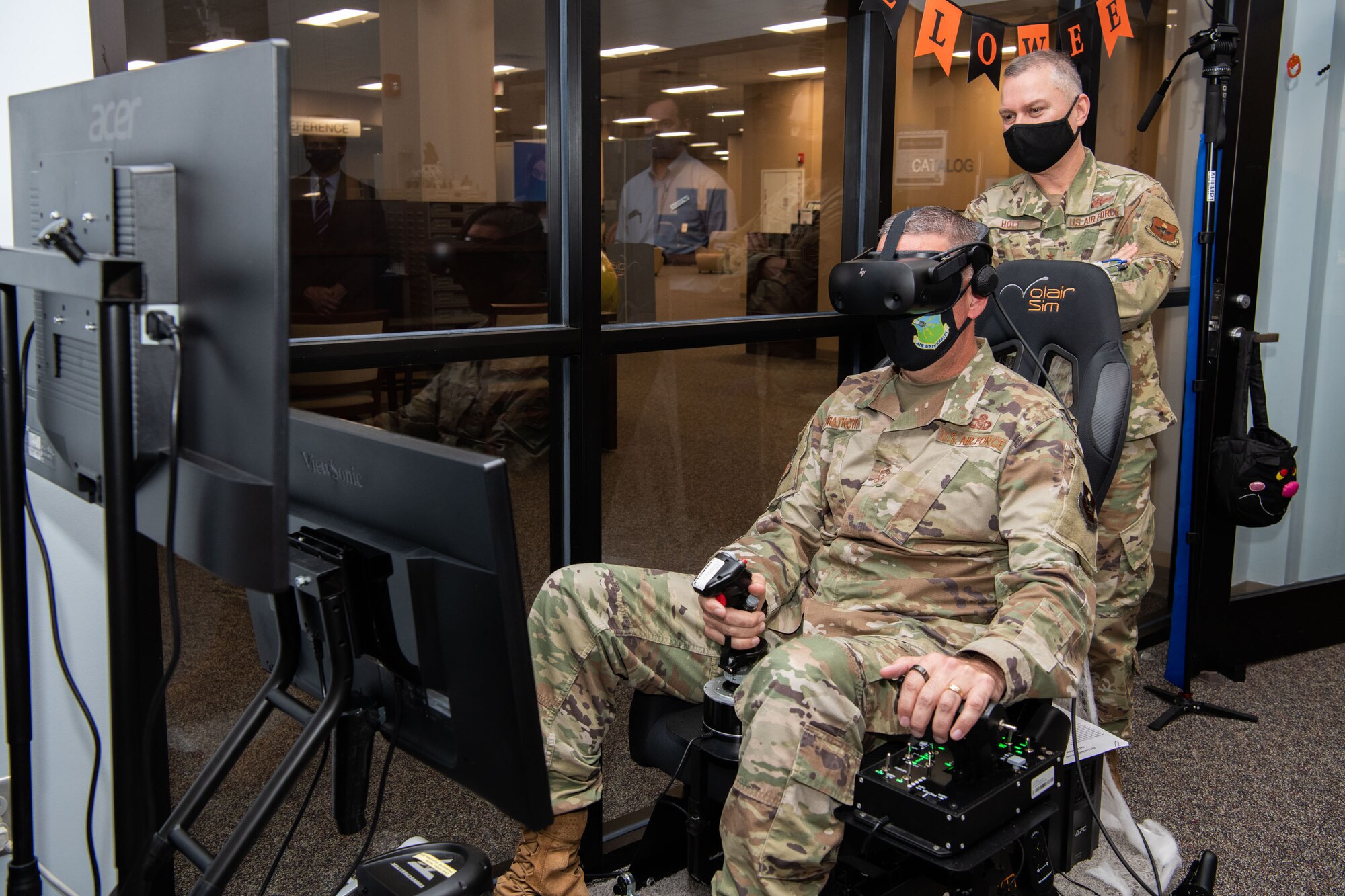 Air University Library and Immersive Learning and Simulation Research Task Force host a ribbon cutting for the new Pilot Training NEXT simulator October 28th 2021 in the Library’s Innovation Lab. (U.S. Air Force photo by William Birchfield)