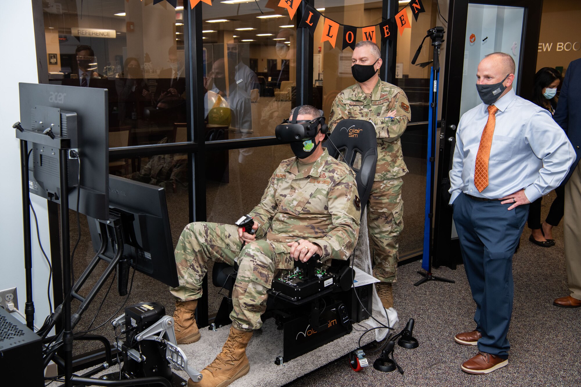 Maxwell AFB, Ala. - Air University Library and Immersive Learning and Simulation Research Task Force host a ribbon cutting for the new Pilot Training NEXT simulator October 28th 2021 in the Library’s Innovation Lab. (U.S. Air Force photo by William Birchfield)