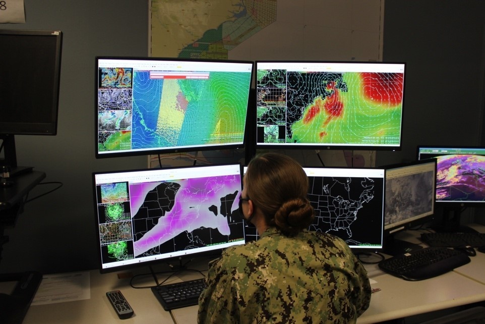 A U.S. Navy Aerographer’s Mate uses the AWIPS display on FWC-Norfolk’s Operations Watchfloor to access the latest model data and real-time observations to create a Surface Chart Analysis for Fleet operations.