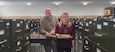 Kathy Boyle, branch manager and Walter Bowman, archivist, pose for a photo surrounded by all the files at the Military records Branch in Frankfort, Ky., Nov. 2, 2021