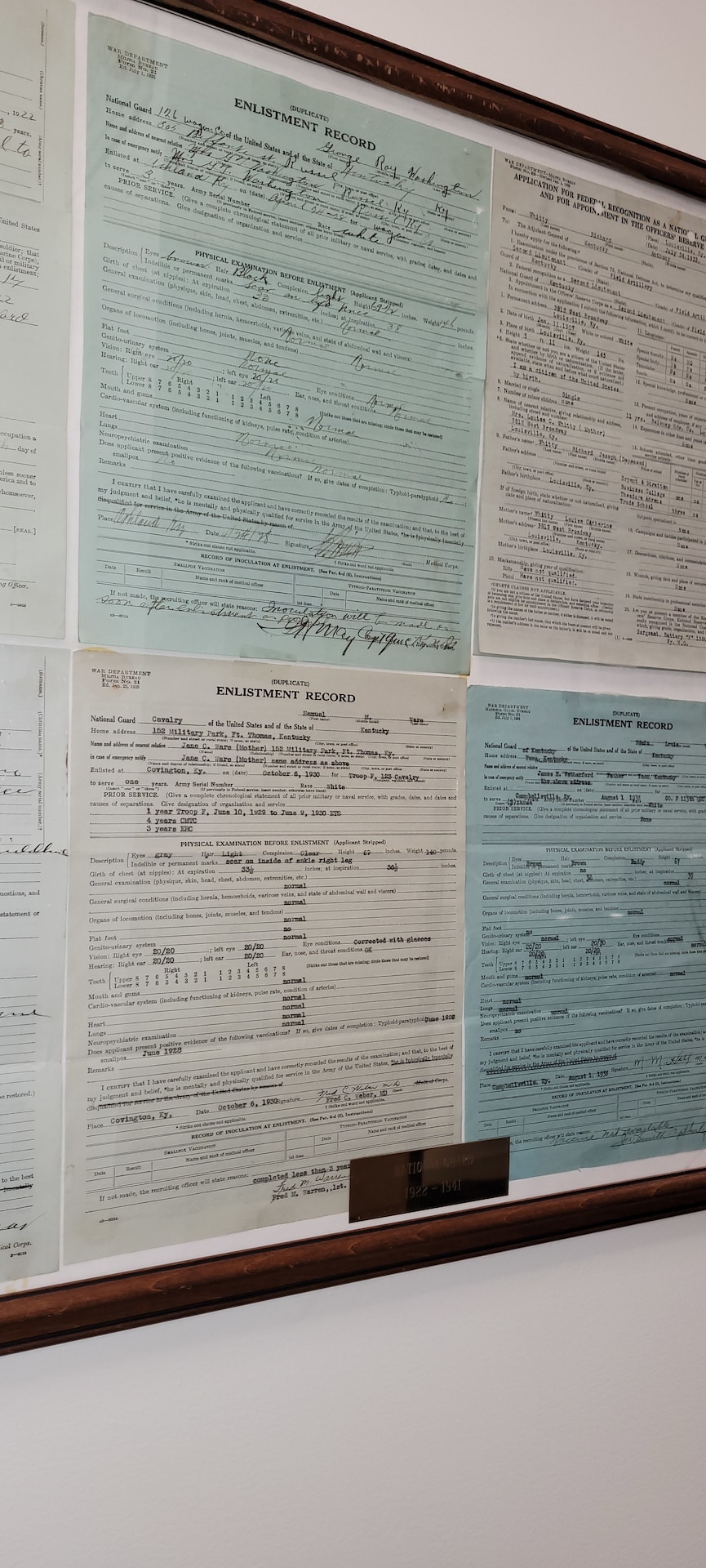 Old DD214's are framed inside the Military Records Brach offices.