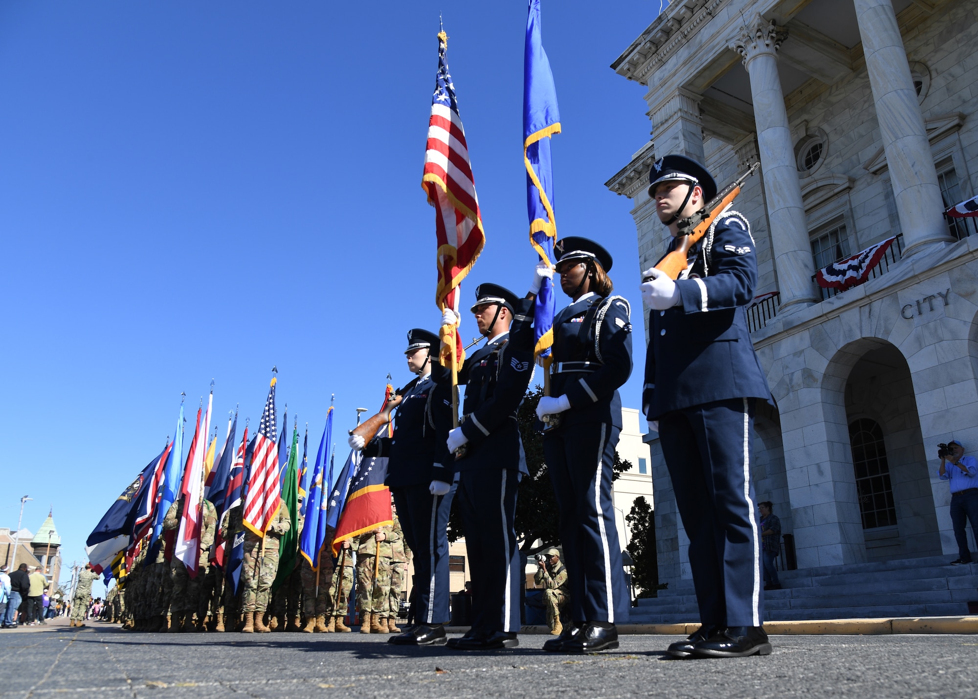 Keesler Air Force Base Honor Guard members present the colors during the 21st Annual Gulf Coast Veterans Day Parade in Biloxi, Mississippi, Nov. 6, 2021. Keesler leadership, along with hundreds of Airmen, attended and participated in the parade in support of all veterans, past and present. More than 50 unique floats, marching bands and military units marched in the largest Veterans Day parade on the Gulf Coast. (U.S. Air Force photo by Kemberly Groue)