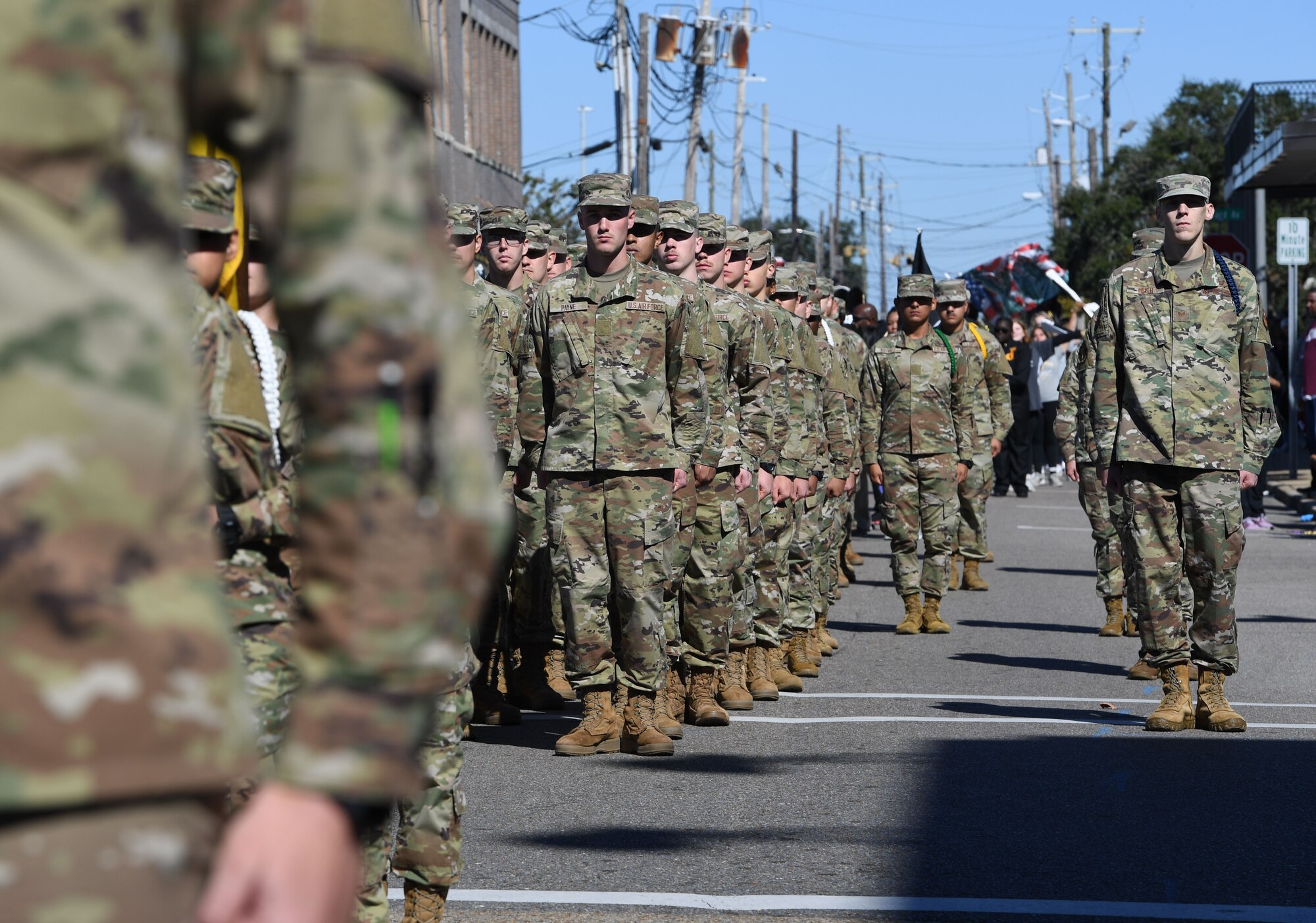 Airmen from the 81st Training Group march in the 21st Annual Gulf Coast Veterans Day Parade in Biloxi, Mississippi, Nov. 6, 2021. Keesler Air Force Base leadership, along with hundreds of Airmen, attended and participated in the parade in support of all veterans, past and present. More than 50 unique floats, marching bands and military units marched in the largest Veterans Day parade on the Gulf Coast. (U.S. Air Force photo by Kemberly Groue)