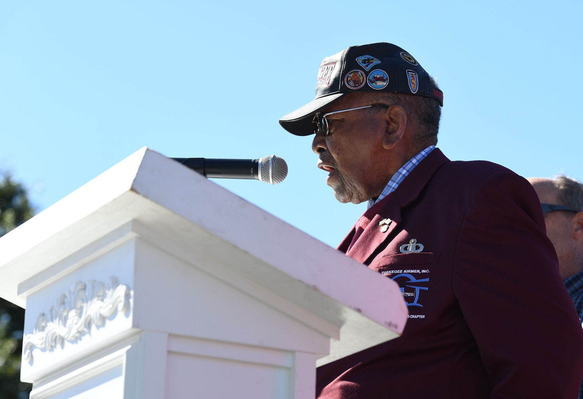 Retired U.S. Air Force Chief Master Sgt. Chris Moore sings the national anthem during the 21st Annual Gulf Coast Veterans Day Parade in Biloxi, Mississippi, Nov. 6, 2021. Keesler Air Force Base leadership, along with hundreds of Airmen, attended and participated in the parade in support of all veterans, past and present. More than 50 unique floats, marching bands and military units marched in the largest Veterans Day parade on the Gulf Coast. (U.S. Air Force photo by Kemberly Groue)