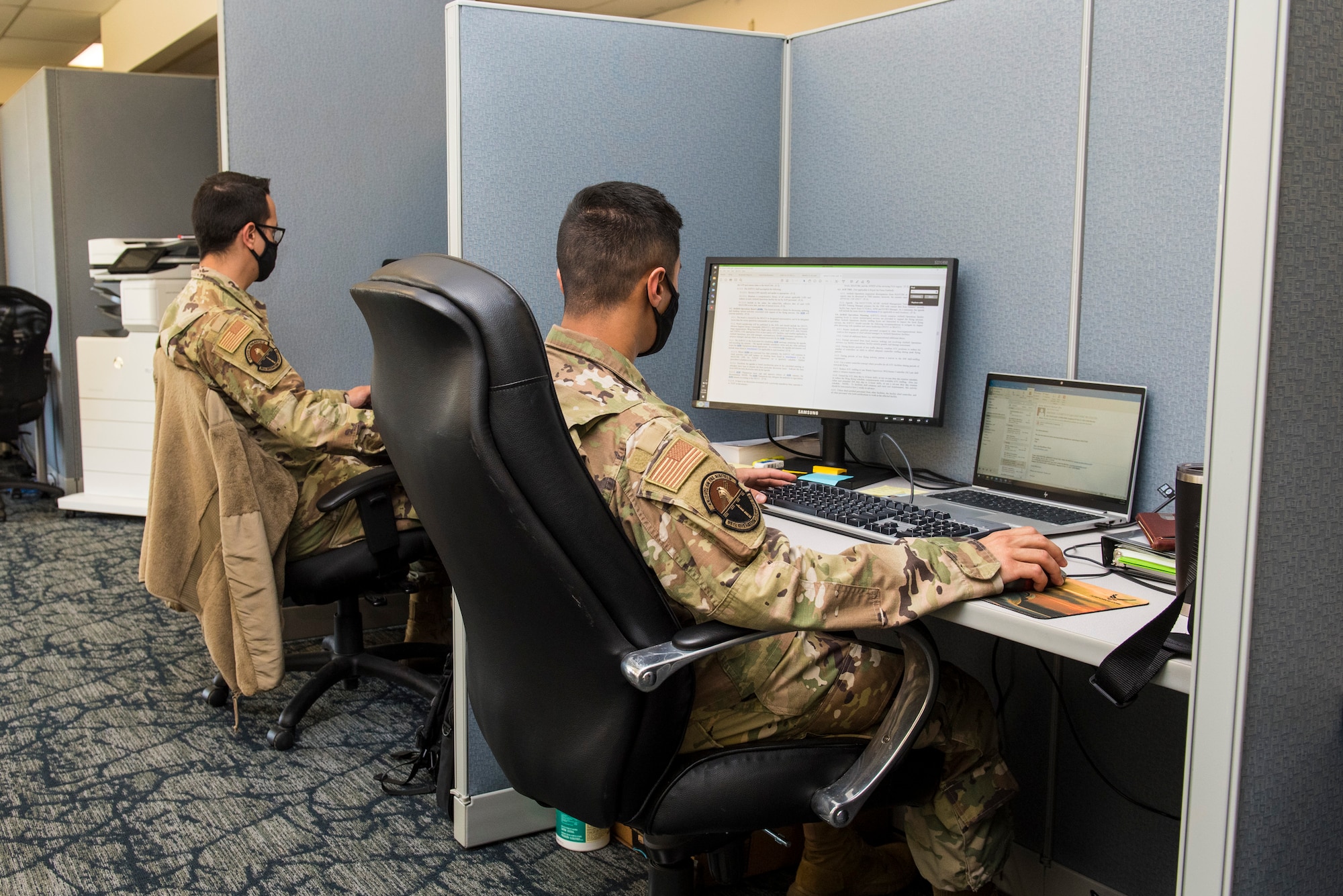 2nd Lt.’s Michael Ober, left, and Abhishek Strestha, right, study at workstations following the opening of the 13M Follow-On Skills Training facility at Wright-Patterson Air Force Base, Nov. 3, 2021. Wright-Patt’s 13M training facility is the first of four to open nationwide in an effort by the Air Force to standardize and accelerate the program. (U.S. Air Force photo by Jaima Fogg)