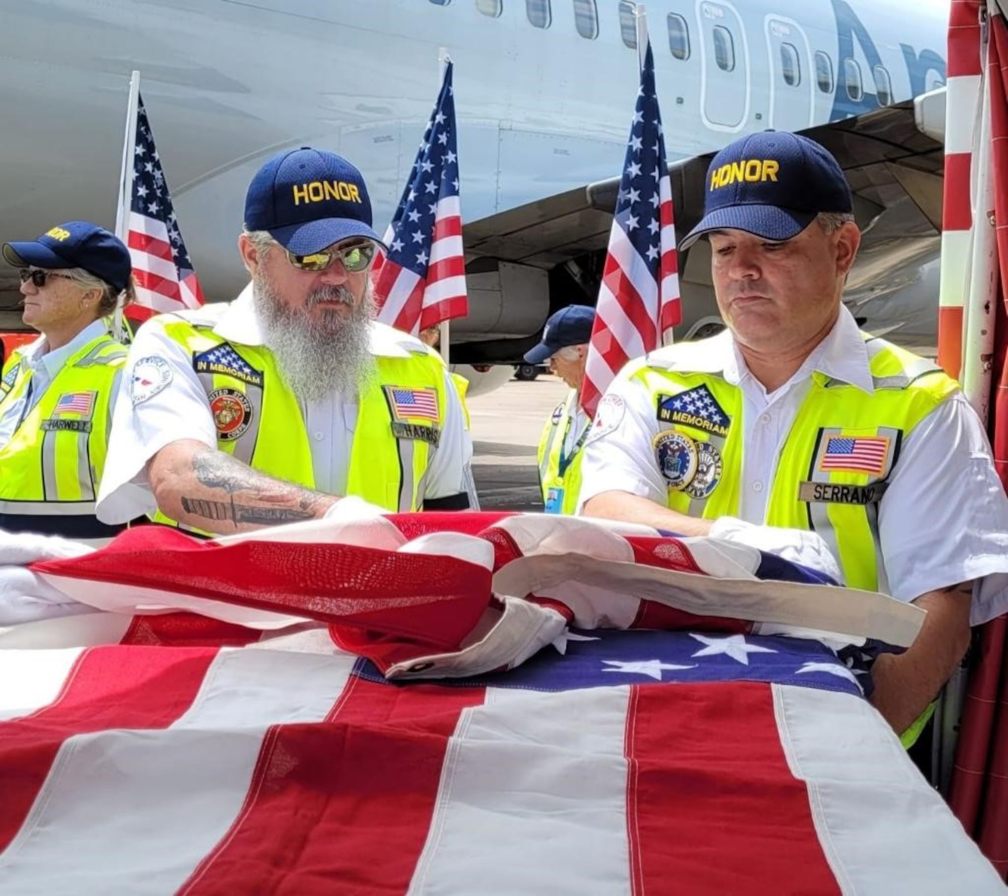 Members of the American Airlines Honor Team finalize the transfer of Army Cpl. Norvin D. Brockett’s remains to the final flight to Washington, D.C.