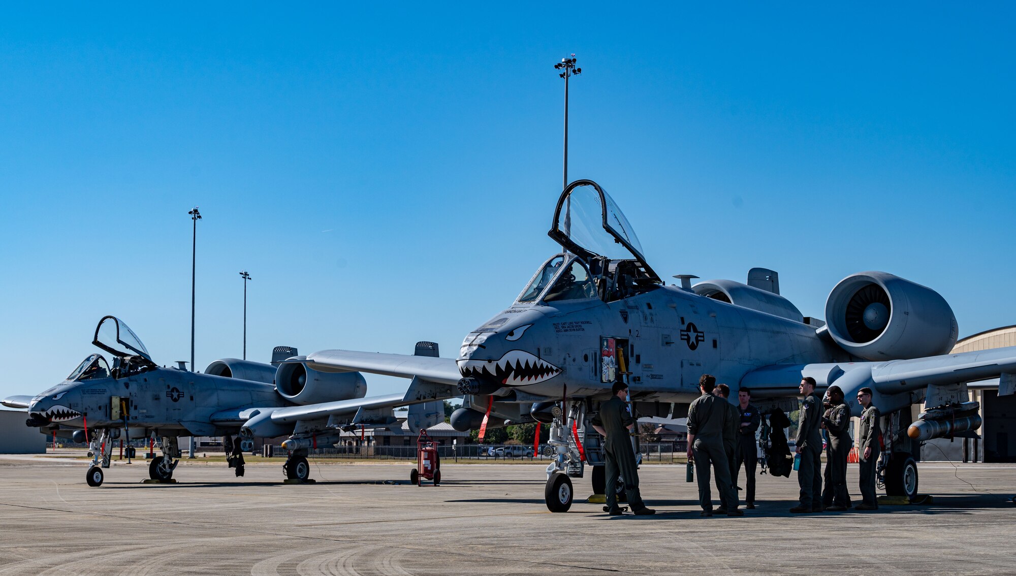 Photo of Airmen looking at an aircraft.
