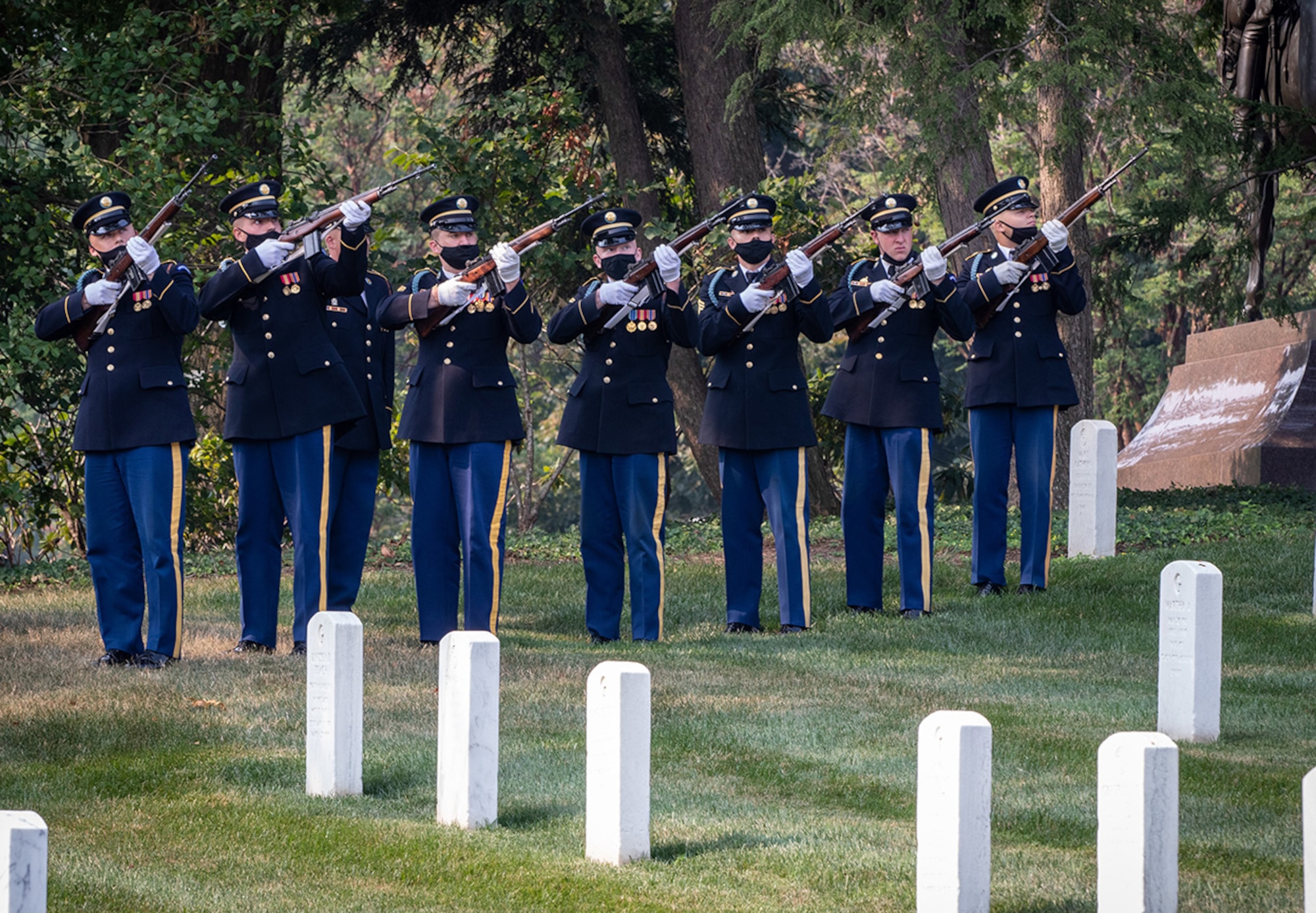 Members of the U.S. Army Honor Guard Firing Party perform a three-volley salute during the funeral of Army Cpl. Norvin D. Brockett on July 21, 2021.
