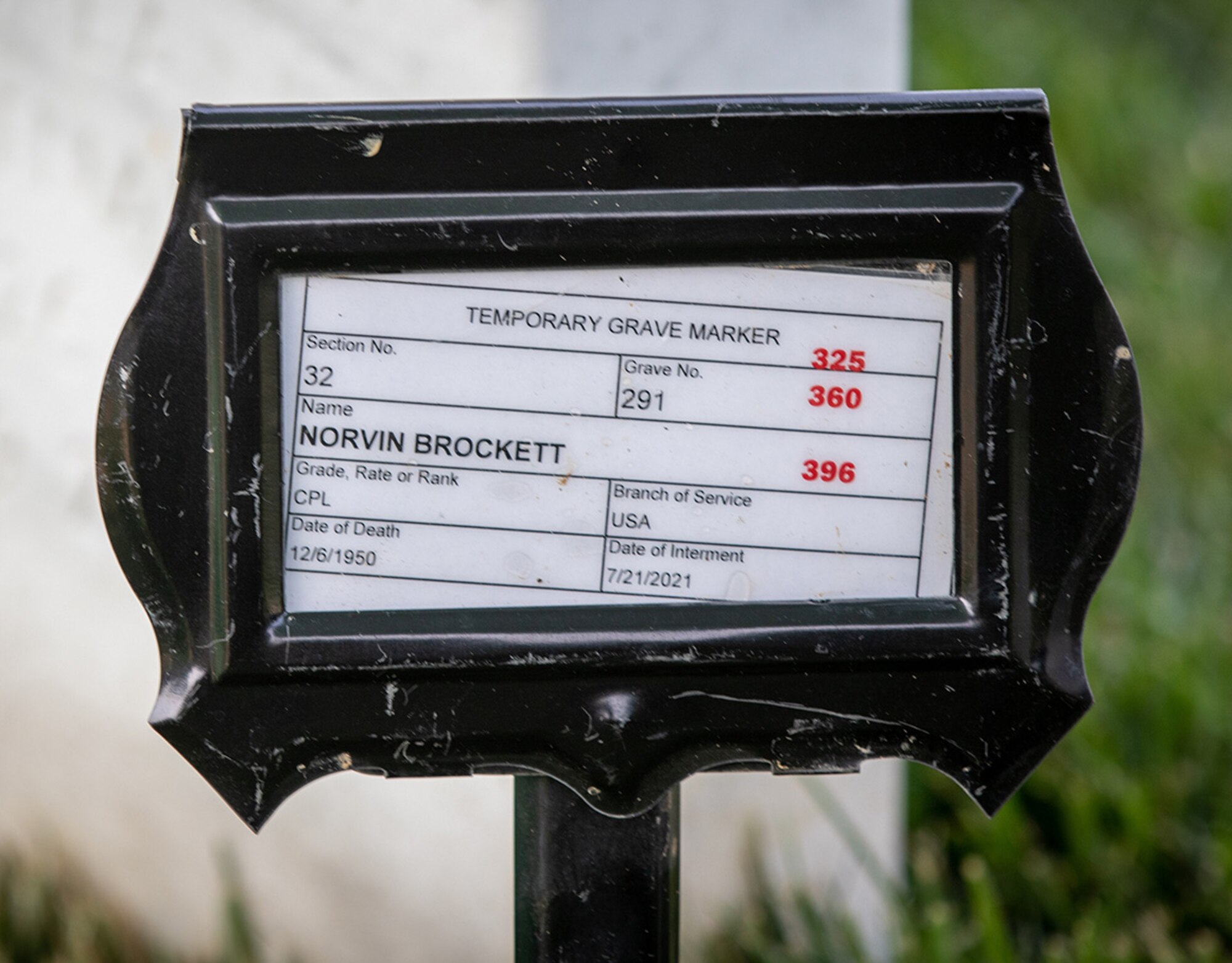 A temporary grave marker identifies the burial site of Army Cpl. Norvin D. Brockett. The marker will be replaced by a white marble headstone.