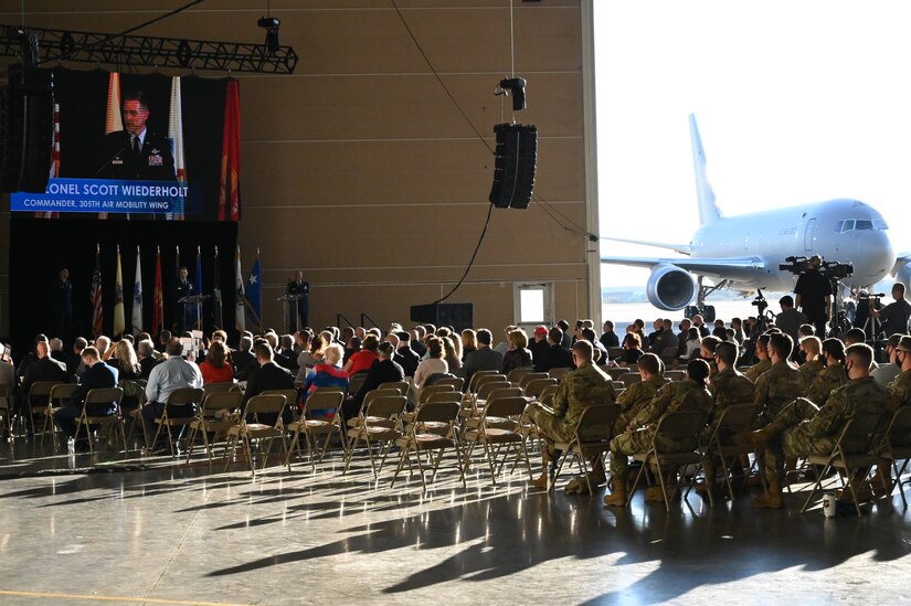 A crowd watched a stage as Col. Scott Wiederholt speaks