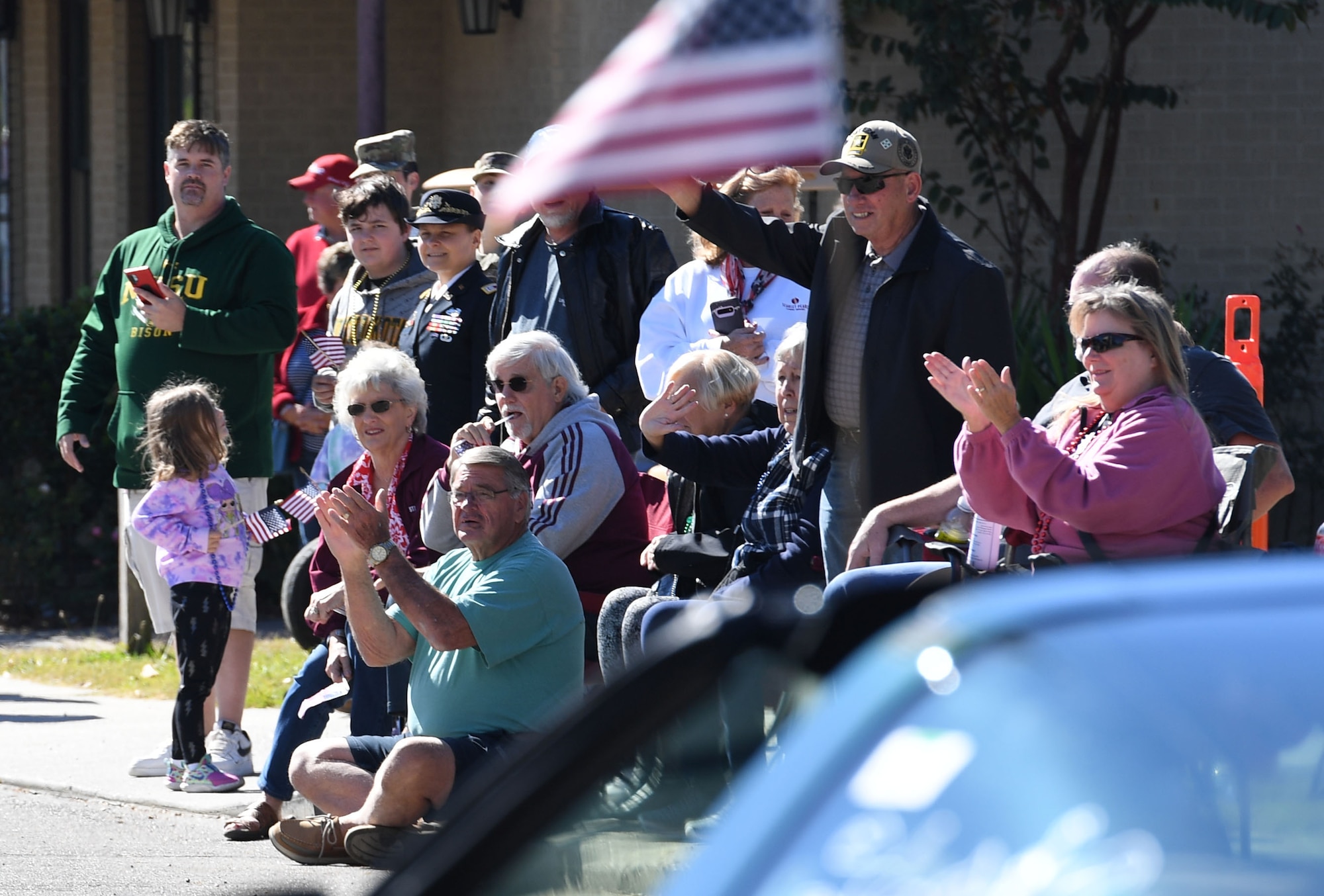 Gulf Coast residents attend the 21st Annual Gulf Coast Veterans Day Parade in Biloxi, Mississippi, Nov. 6, 2021. Keesler Air Force Base leadership, along with hundreds of Airmen, attended and participated in the parade in support of all veterans, past and present. More than 50 unique floats, marching bands and military units marched in the largest Veterans Day parade on the Gulf Coast. (U.S. Air Force photo by Kemberly Groue)
