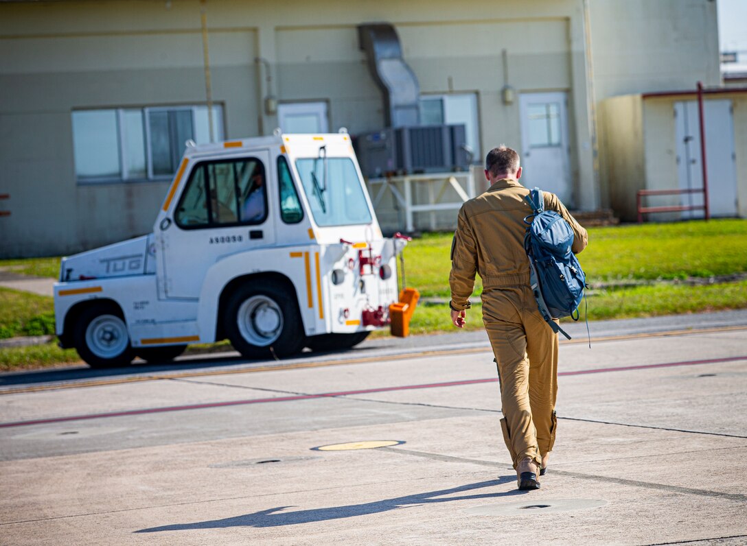 A member of the French Navy exits the runway after off-boarding the French maritime surveillance aircraft, Falcon F200, also known as "Gardian," prior to its departure on Marine Corps Air Station Futenma, Okinawa, Japan, Nov. 2, 2021.The arrival and departure of the aircraft on MCAS Futenma, one of the seven UNC-R bases in Japan, shows a continuous partnership between the UNC-R and the host nation. (U.S. Marine Corps photo by Lance Cpl. Alex Fairchild)