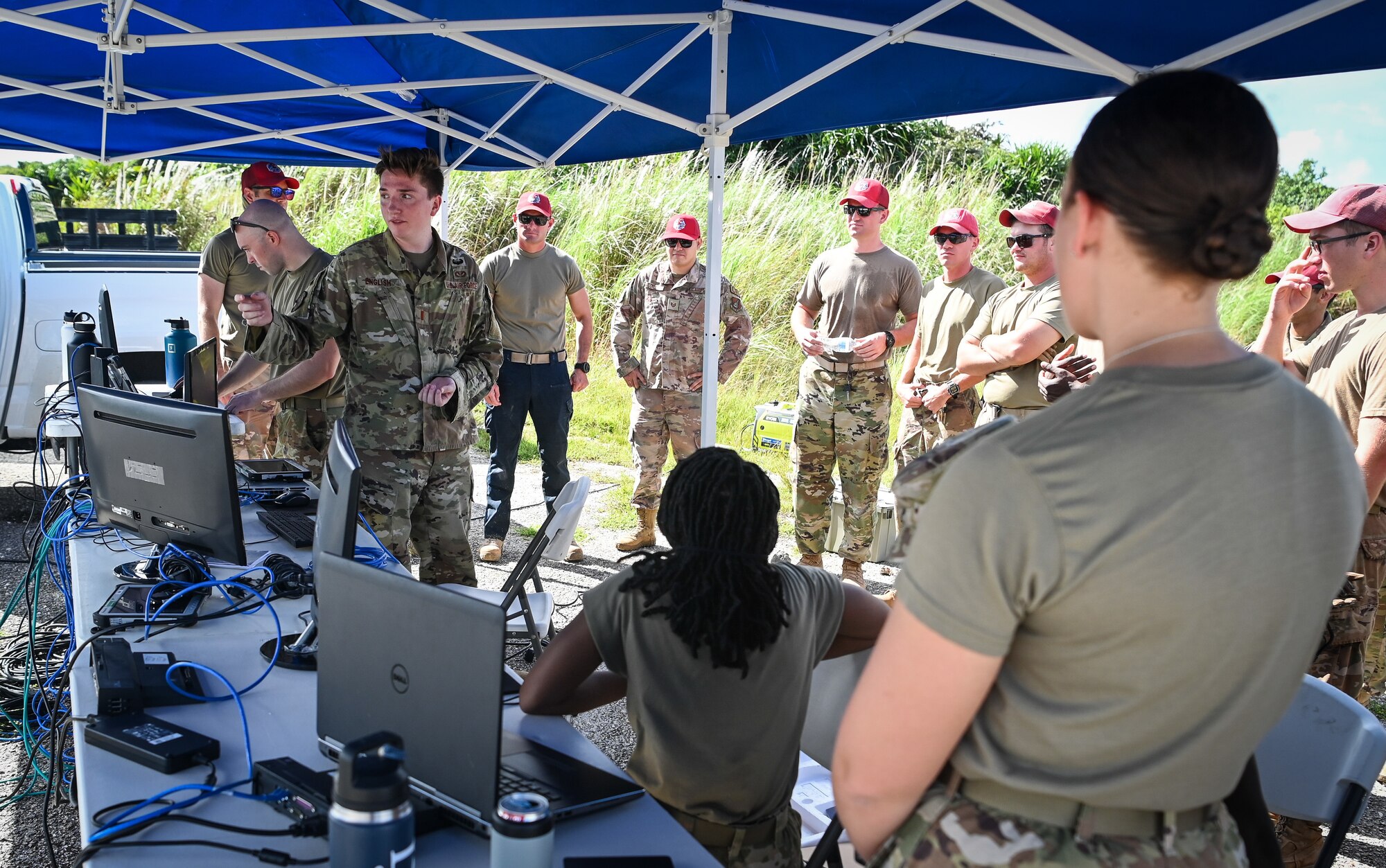 U.S. Air Force 2nd Lt. Ryan English, project programmer assigned to the 36th Civil Engineering Squadron, explain Rapid Airfield Damage Assessment System to members of the 544th Rapid Engineer Deployable Heavy Operational Repair Squadron Engineer at Andersen Air Force Base, Guam, Nov. 5, 2021.