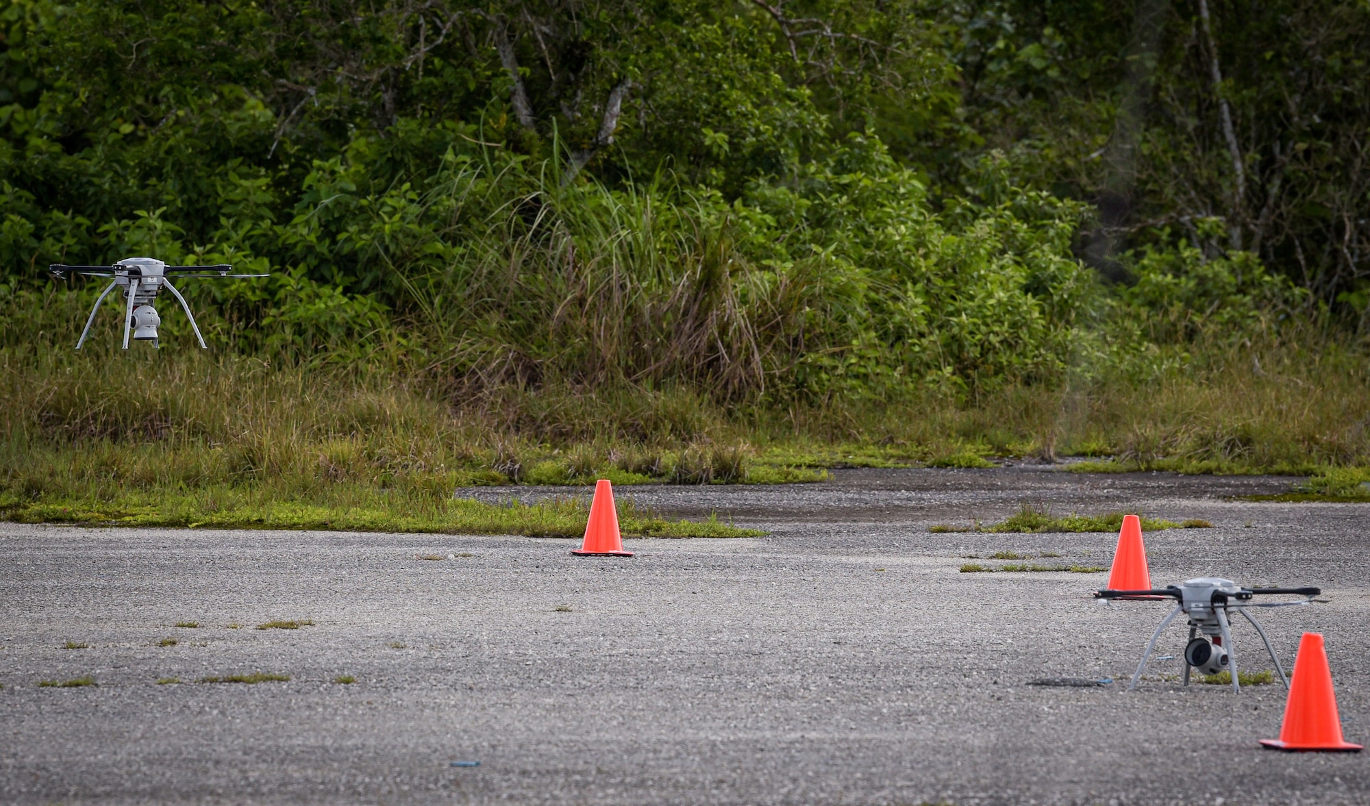 U.S. Air Force civil engineers fly a Small Unmanned Aircraft System during Rapid Airfield Damage Assessment System testing at Andersen Air Force Base, Guam, Nov. 5, 2021.