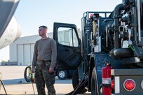 Airman Dennis Haggermaker, 22nd Logistics Readiness Squadron fuels distribution operator, simulates refueling a KC-135 Stratotanker during Global Thunder Nov. 5, 2021, at McConnell Air Force Base,  Kansas. Fuels distribution operators use the R-12 fuel truck to connect aircraft to the ground-based fuel hydrant outlets allowing for a transfer of fuel. Global Thunder is an annual command and control exercise designed to train U.S. Strategic Command forces and assess joint operation readiness. (U.S. Air Force Photo by Airman 1st Class Zachary Willis)