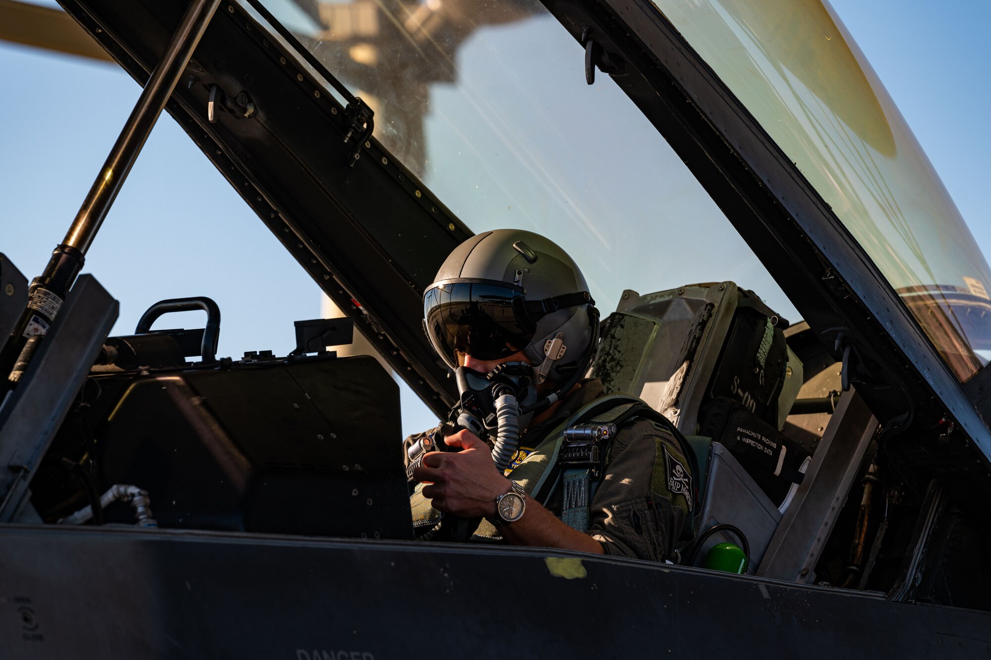 Photo of a pilot in a jet.