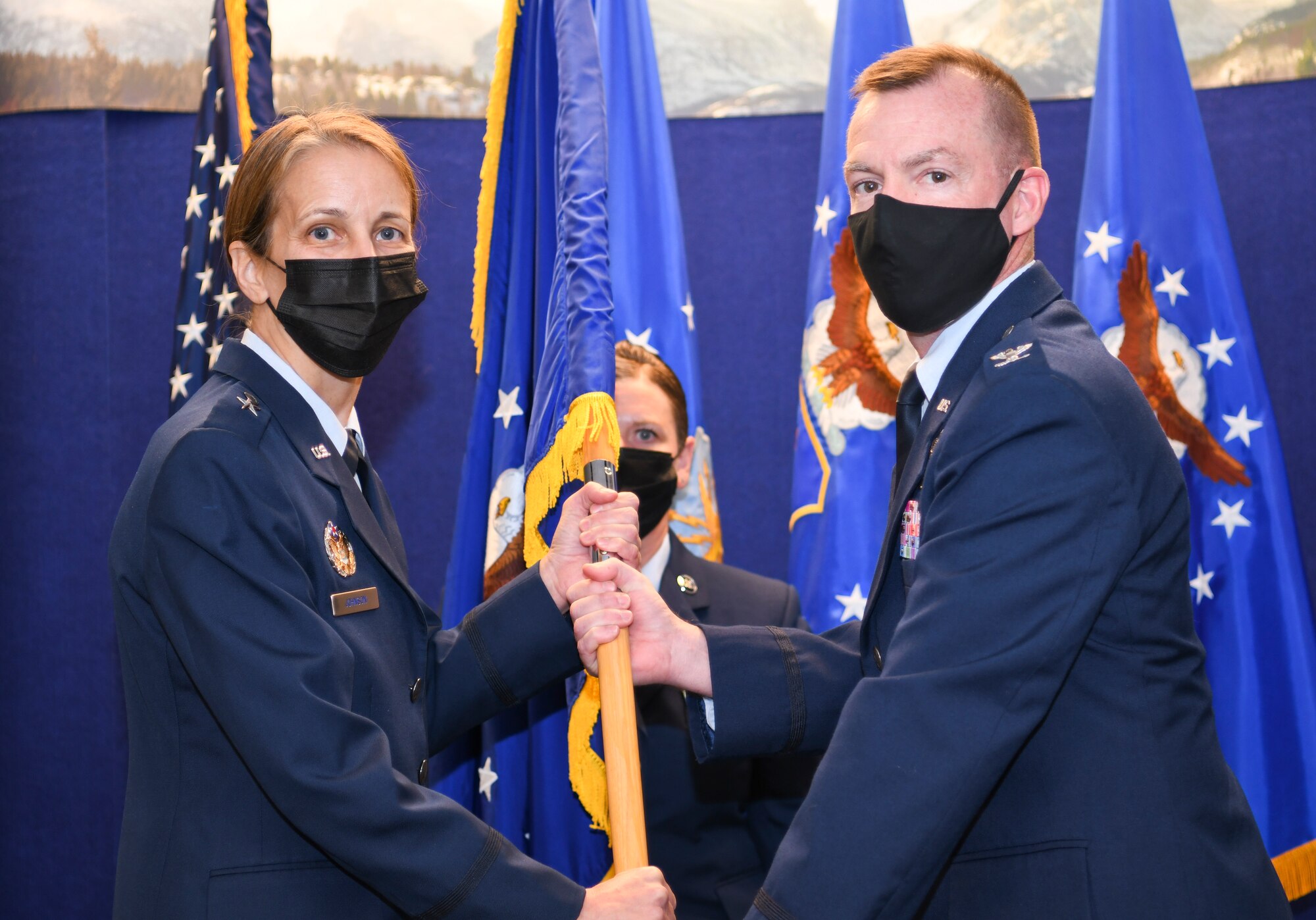 Col. Edward Segura receives command of Headquarters Individual Reservist Readiness Integration Center from Brig. Gen. Jennie Johnson, Headquarters Air Reserve Personnel Center commander, on Buckley Space Force Base, Nov. 8, 2021. (U.S. Air Force photo by Tech. Sgt. Cory Payne)