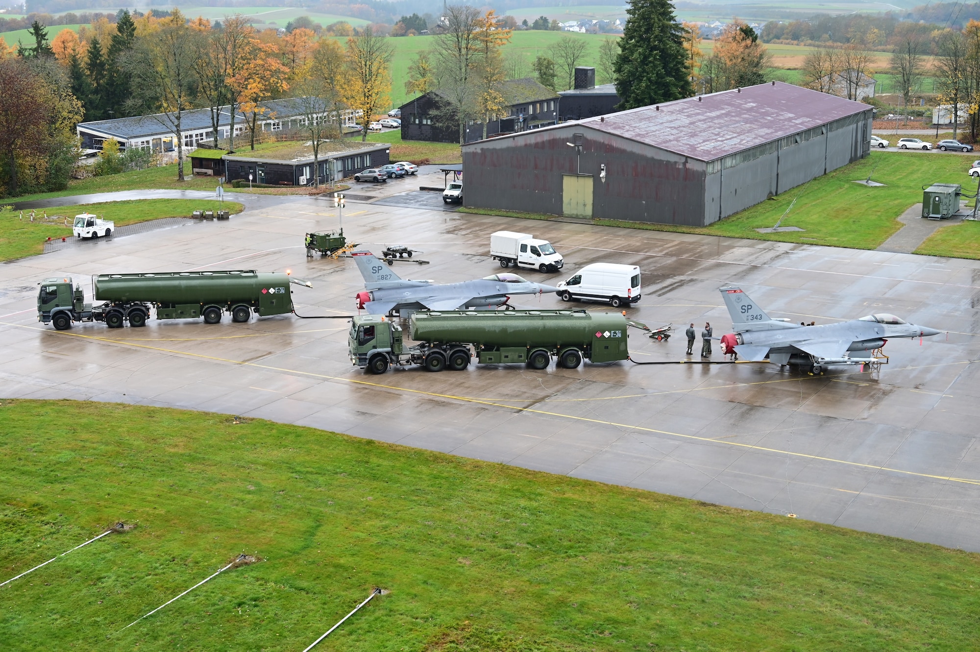 U.S. Air Force Airmen from the 52nd Aircraft Maintenance Squadron show members of the German Air Force how to refuel U.S. Air Force F-16C Fighting Falcon fighter jets during Castle Forge, an Agile Combat Employment exercise at Büchel Air Base, Germany, Nov. 3, 2021. The integration, part of a U.S. Air Forces in Europe-Air Forces Africa Agile Combat Employment event, gave both nations the opportunity to train together and improve interoperability for future operations and contingencies in the region. (Courtesy photo by Dr. Sandeep Mulgund)