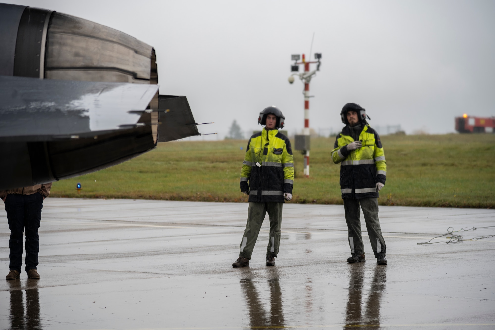Two German Air Force aircraft maintainers prepare to launch a U.S. Air Force F-16C Fighting Falcon fighter jet during an Agile Combat Employment exercise at Büchel Air Base, Germany, Nov. 3, 2021. ACE is a concept of operations that envisions the use of agile operations to generate resilient airpower in a contested environment, thus enhancing our ability to deter, defend and win across the spectrum of conflict. (U.S. Air Force photo by Senior Airman Ali Stewart)