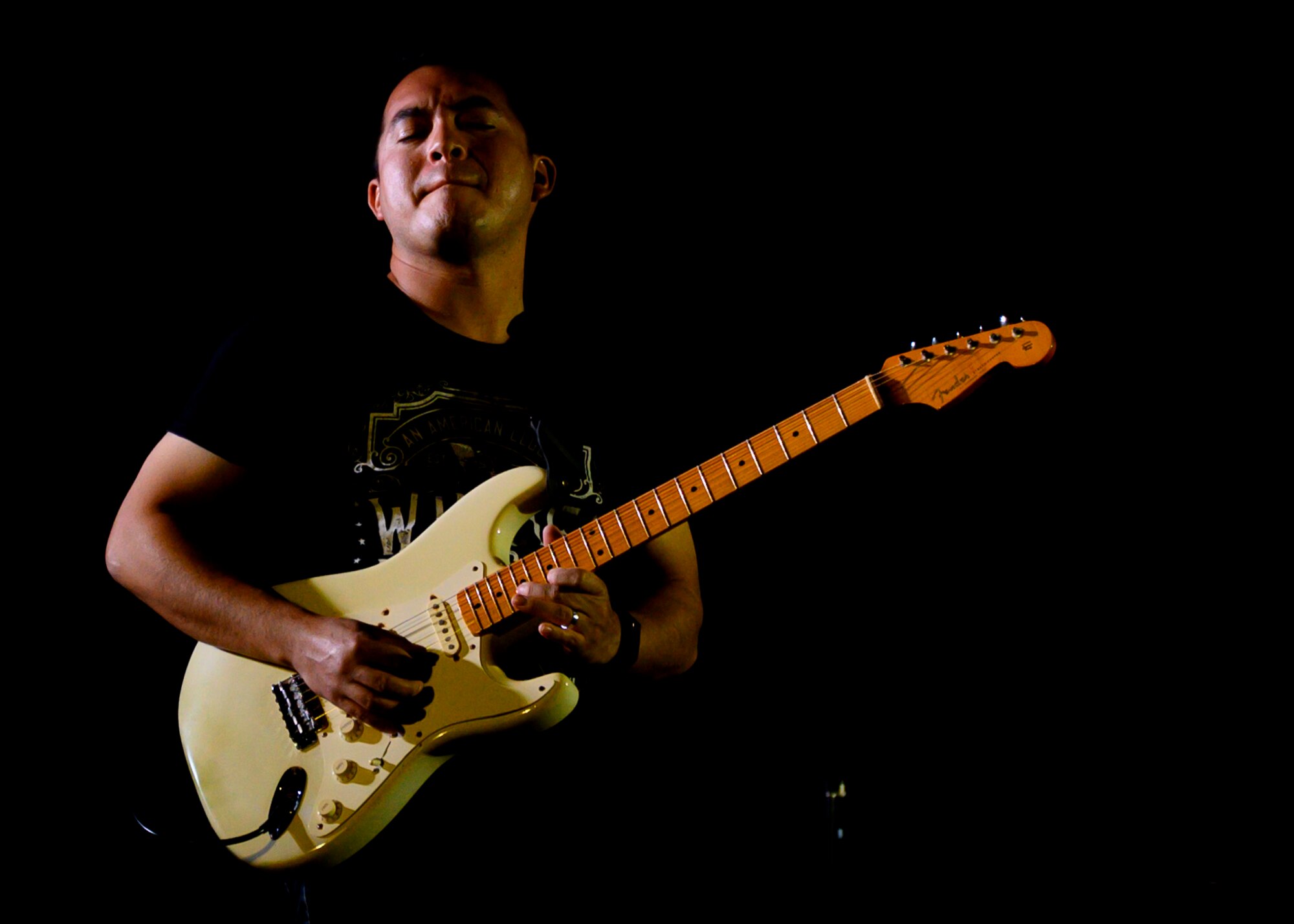 U.S. Air Force Airman 1st Class Christopher Arellano, U.S. Air Forces Central Band guitarist, performs during a concert at Prince Sultan Air Base, Kingdom of Saudi Arabia, Oct. 15, 2021. The 378th Air Expeditionary Wing hosted two nights of performances in recognition and celebration of the base’s accomplishments throughout the past summer. (U.S. Air Force photo by Senior Airman Samuel Earick)