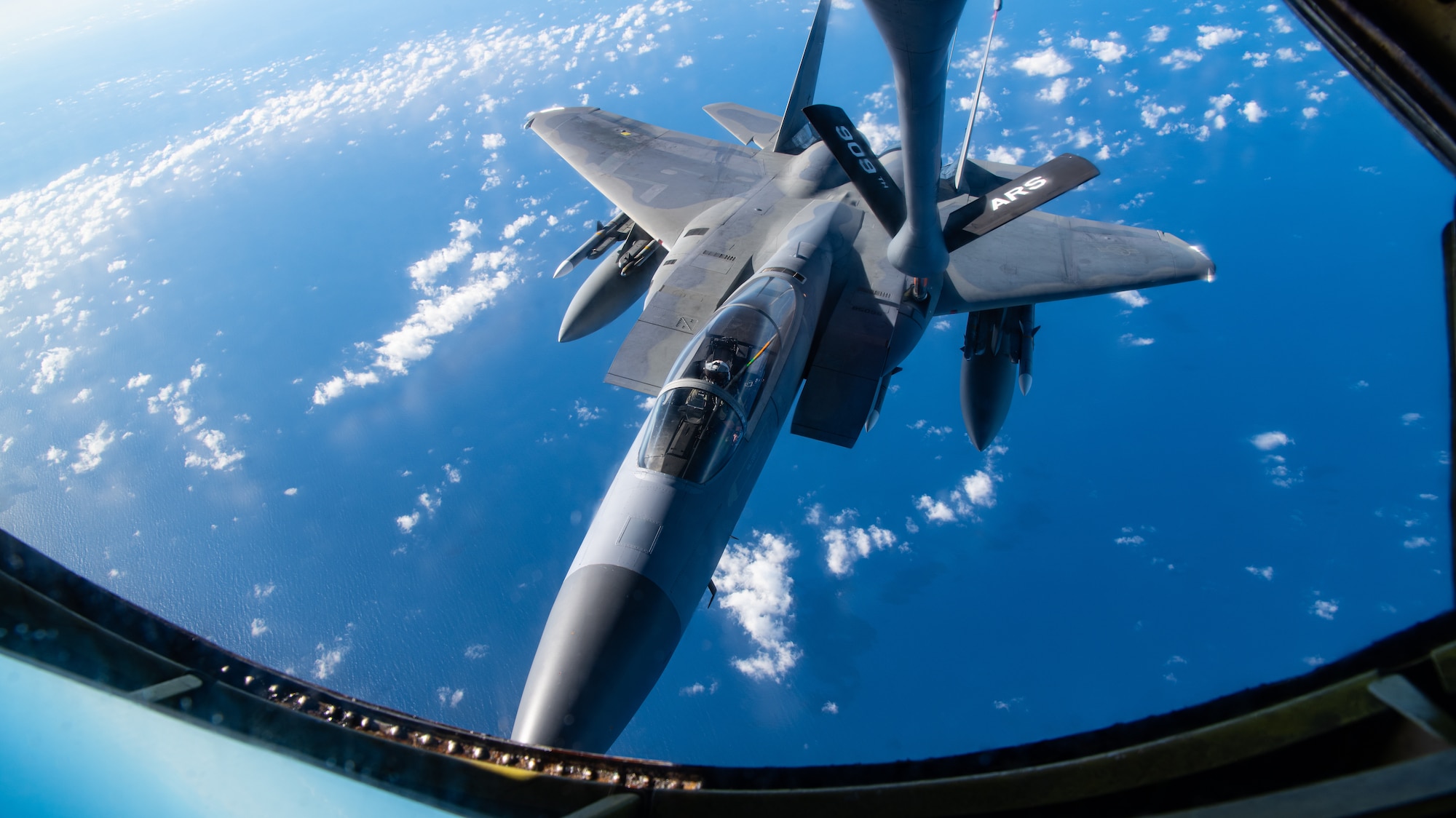A photo of an F-15C Eagle receiving fuel from a KC-135 Stratotanker