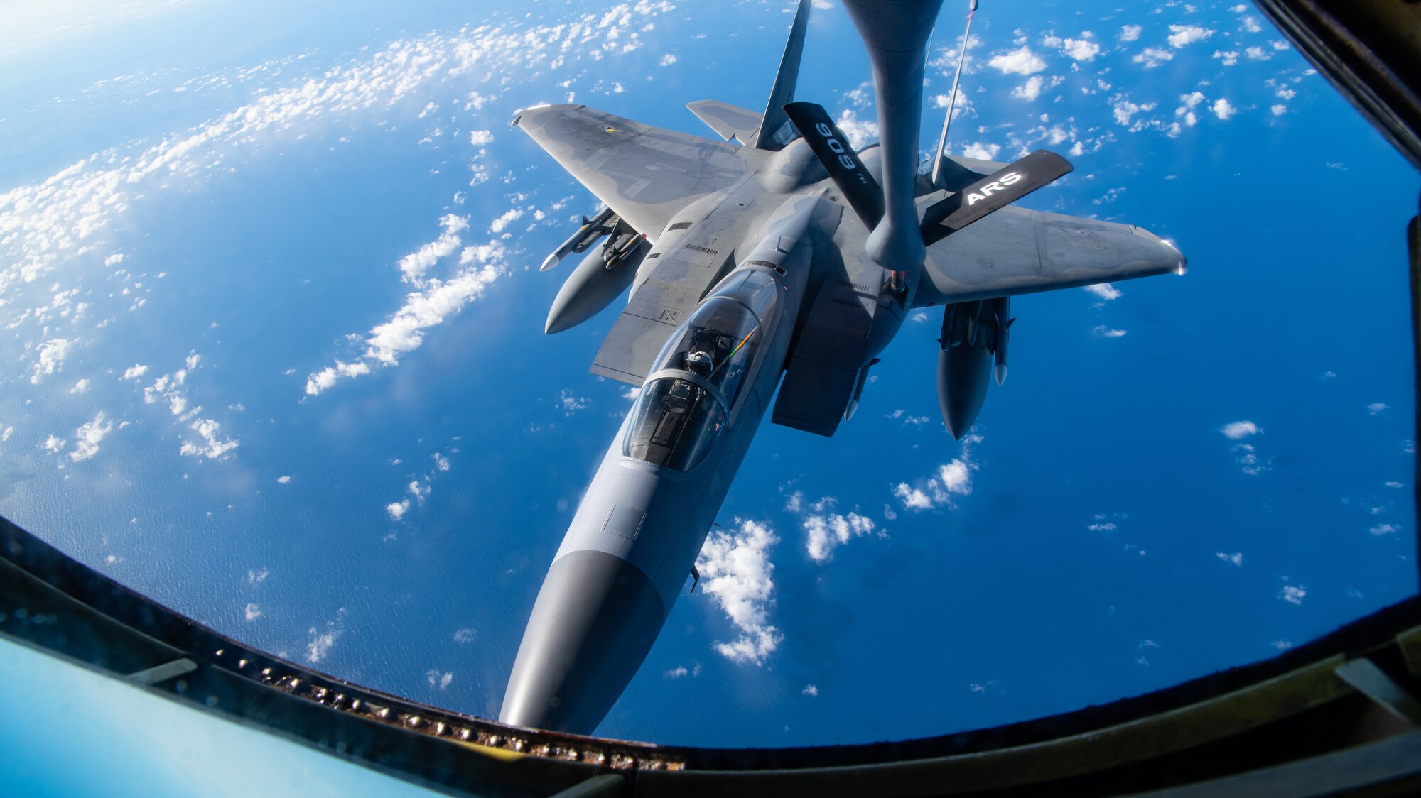 A photo of an F-15C Eagle receiving fuel from a KC-135 Stratotanker