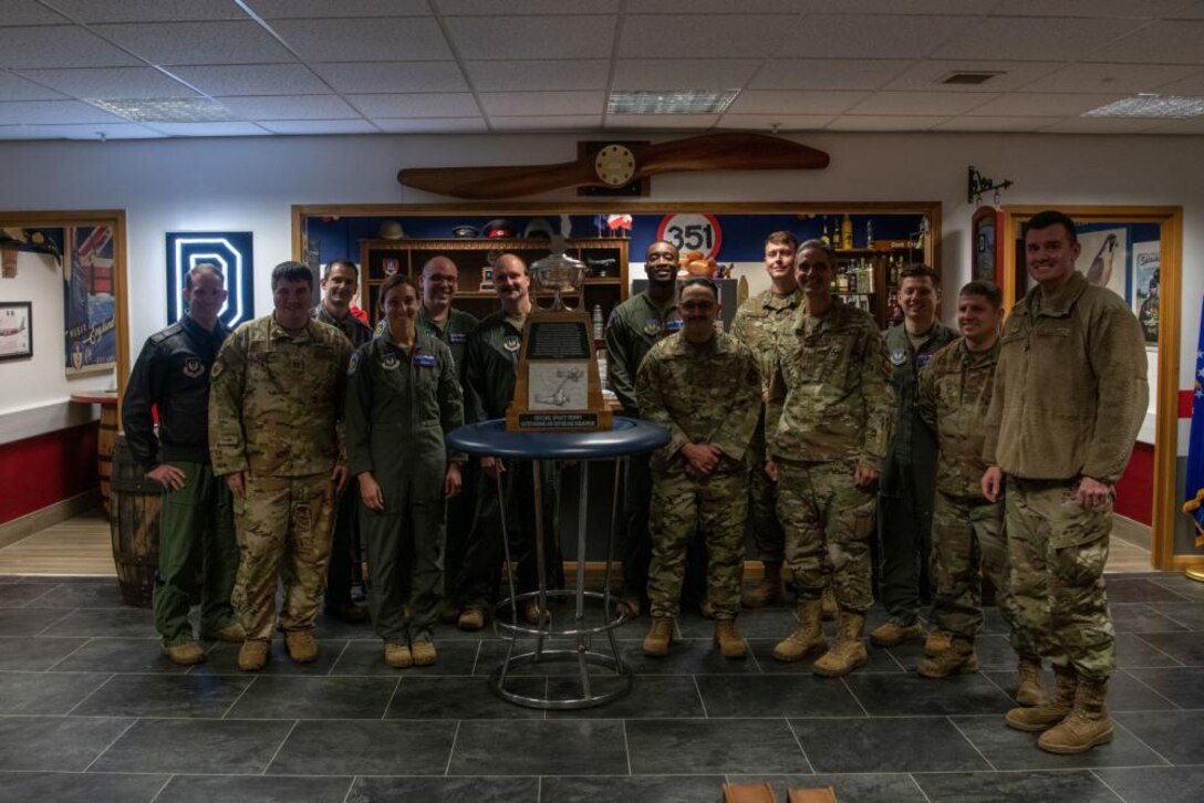 U.S. Air Force Lt. Gen. Steven Basham, U.S. Air Forces in Europe and Air Forces Africa deputy commander, discusses with a group of maintenance Airmen about the capabilities of a KC-135 Stratotanker aircraft at Royal Air Force Mildenhall, England, Nov. 3, 2021. Basham’s visit during exercise Castle Forge allowed him to see how the 100th ARW is implementing future Air Force Warfighting concepts into its training and operations. (U.S. Air Force photo by Senior Airman Nicholas Swift)