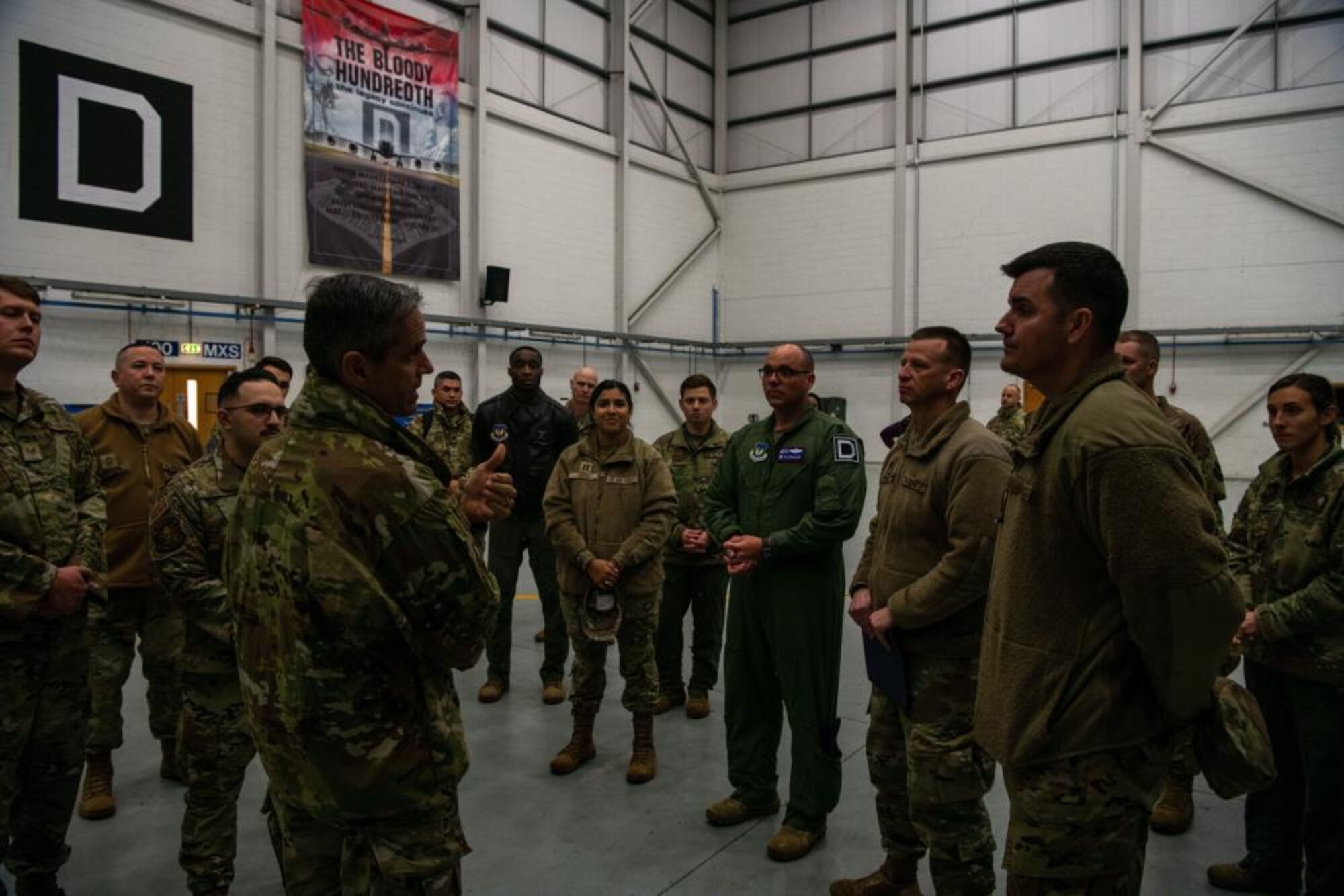 U.S. Air Force Lt. Gen. Steven Basham, U.S. Air Forces in Europe and Air Forces Africa deputy commander, discusses with a group of maintenance Airmen about the capabilities of a KC-135 Stratotanker aircraft at Royal Air Force Mildenhall, England, Nov. 3, 2021. Basham’s visit during exercise Castle Forge allowed him to see how the 100th ARW is implementing future Air Force Warfighting concepts into its training and operations. (U.S. Air Force photo by Senior Airman Nicholas Swift)
