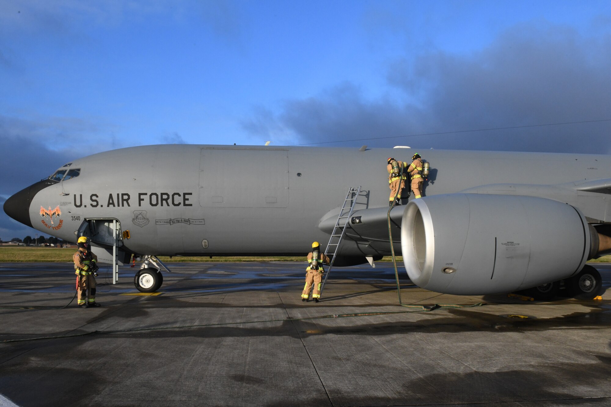 Firefighters assigned to the 100th Civil Engineer Squadron respond to a simulated aircraft mishap on a KC-135 Stratotanker aircraft at Royal Air Force Mildenhall, England, Nov. 4, 2021. The aircraft mishap was part of a readiness exercise that allowed emergency service personnel to practice how they would respond in a real life incident. (U.S. Air Force photo by Tech. Sgt. Anthony Hetlage)