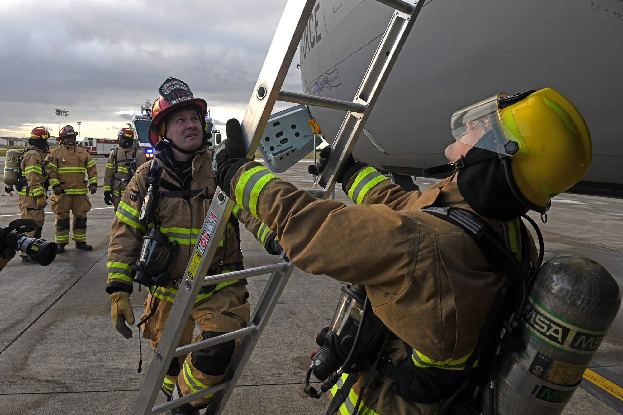 Firefighters assigned to the 100th Civil Engineer Squadron respond to a simulated aircraft mishap on a KC-135 Stratotanker aircraft at Royal Air Force Mildenhall, England, Nov. 4, 2021. The aircraft mishap was part of a readiness exercise that allowed emergency service personnel to practice how they would respond in a real life incident. (U.S. Air Force photo by Tech. Sgt. Anthony Hetlage)