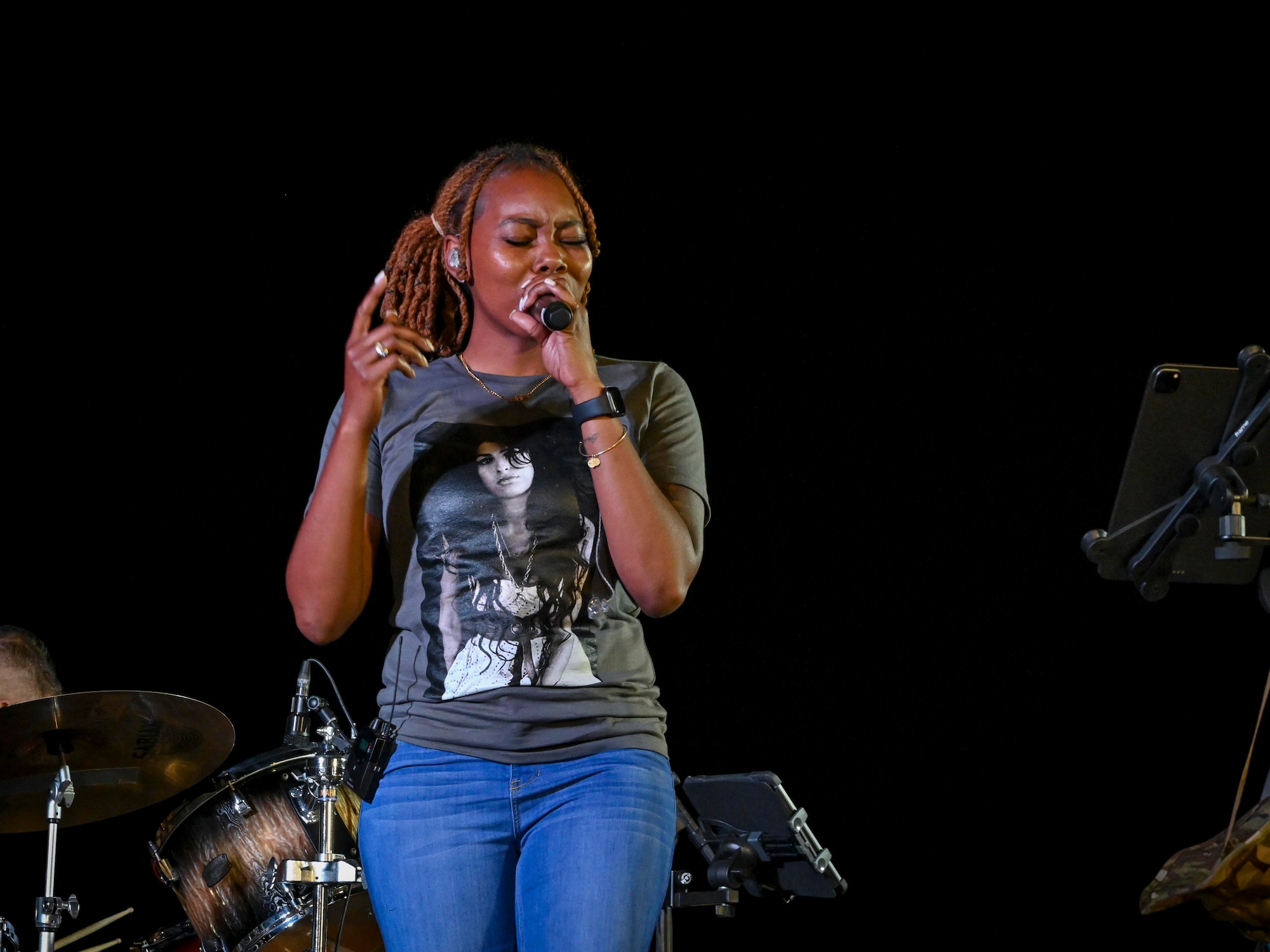 U.S. Air Force Senior Airman MeLan Smartt, U.S. Air Forces Band vocalist, performs during a concert at Prince Sultan Air Base, Kingdom of Saudi Arabia, Oct. 16, 2021. The 378th Air Expeditionary Wing hosted two nights of performances in recognition and celebration of the base’s accomplishments throughout the past summer. (U.S. Air Force photo by Capt. Rachel Buitrago)