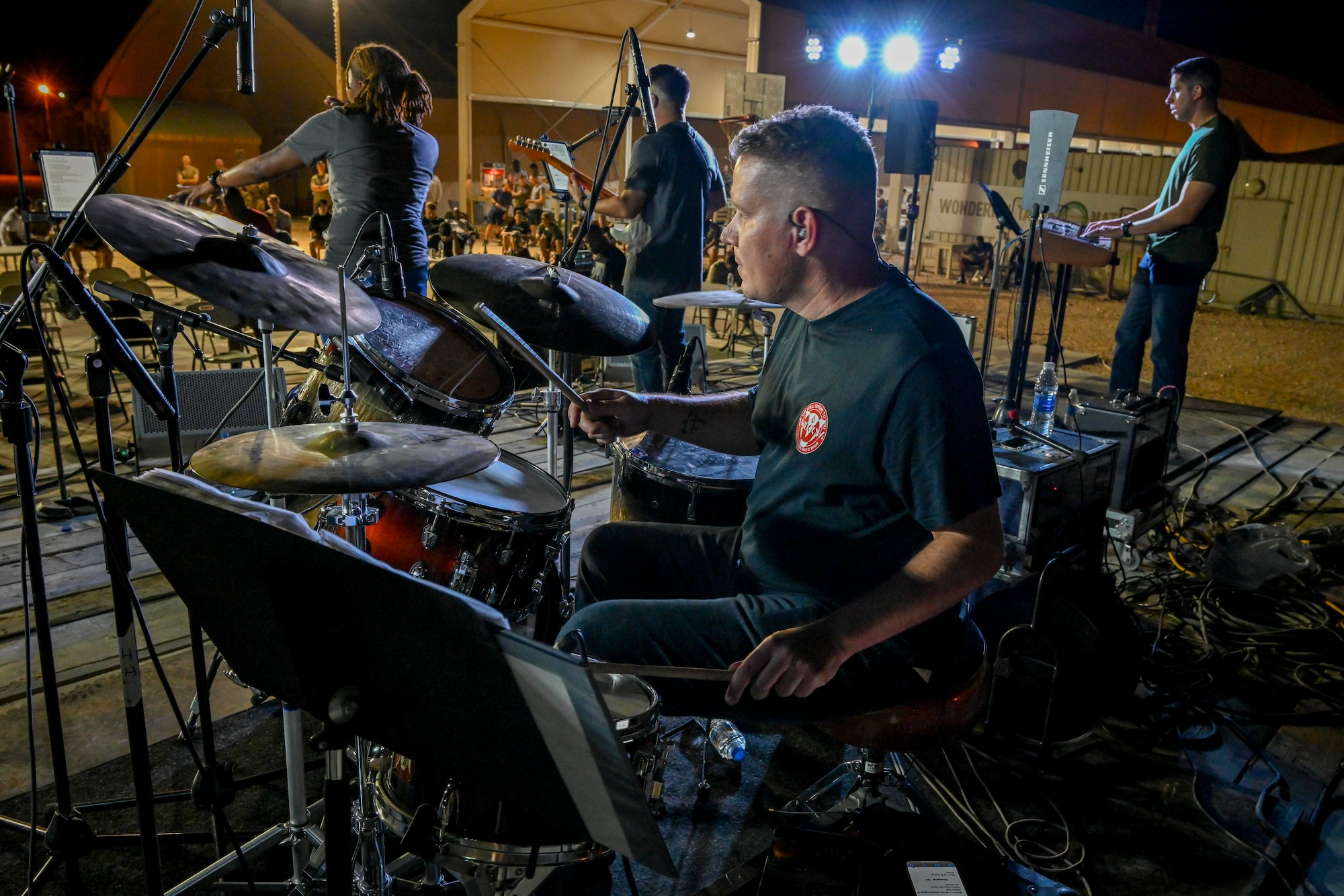 U.S. Air Force Tech. Sgt. Andrew Wendzikowski, U.S. Air Forces Central Band drums player, performs during a concert at Prince Sultan Air Base, Kingdom of Saudi Arabia, Oct. 16, 2021. The 378th Air Expeditionary Wing hosted two nights of performances in recognition and celebration of the base’s accomplishments throughout the past summer. (U.S. Air Force photo by Capt. Rachel Buitrago)