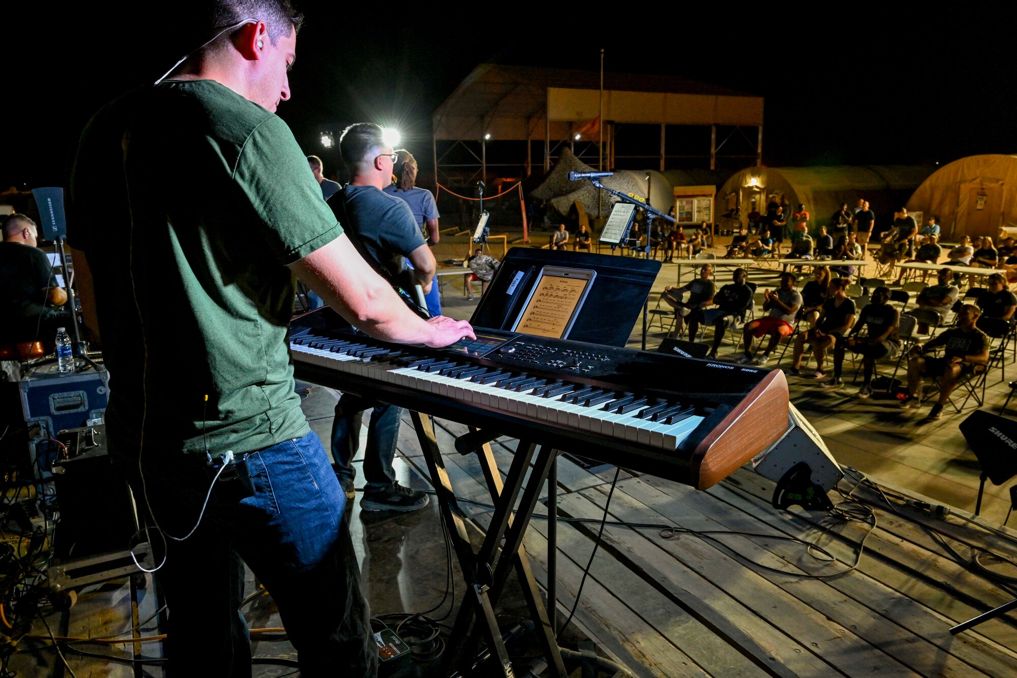 U.S. Air Force Airman 1st Class Phillip Castro, U.S. Air Forces Central Band pianist, performs during a concert at Prince Sultan Air Base, Kingdom of Saudi Arabia, Oct. 16, 2021. The 378th Air Expeditionary Wing hosted two nights of performances in recognition and celebration of the base’s accomplishments throughout the past summer. (U.S. Air Force photo by Capt. Rachel Buitrago)