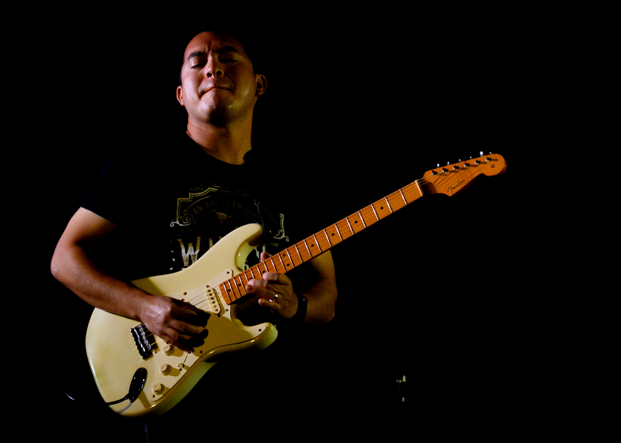 U.S. Air Force Airman 1st Class Christopher Arellano, U.S. Air Forces Central Band guitarist, performs during a concert at Prince Sultan Air Base, Kingdom of Saudi Arabia, Oct. 15, 2021. The 378th Air Expeditionary Wing hosted two nights of performances in recognition and celebration of the base’s accomplishments throughout the past summer. (U.S. Air Force photo by Senior Airman Samuel Earick)