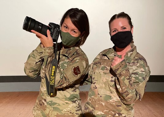 Chief Master Sgt. of the Air Force JoAnne S. Bass holds poses for a picture with U.S. Air Force Senior Airman Abbey Rieves.