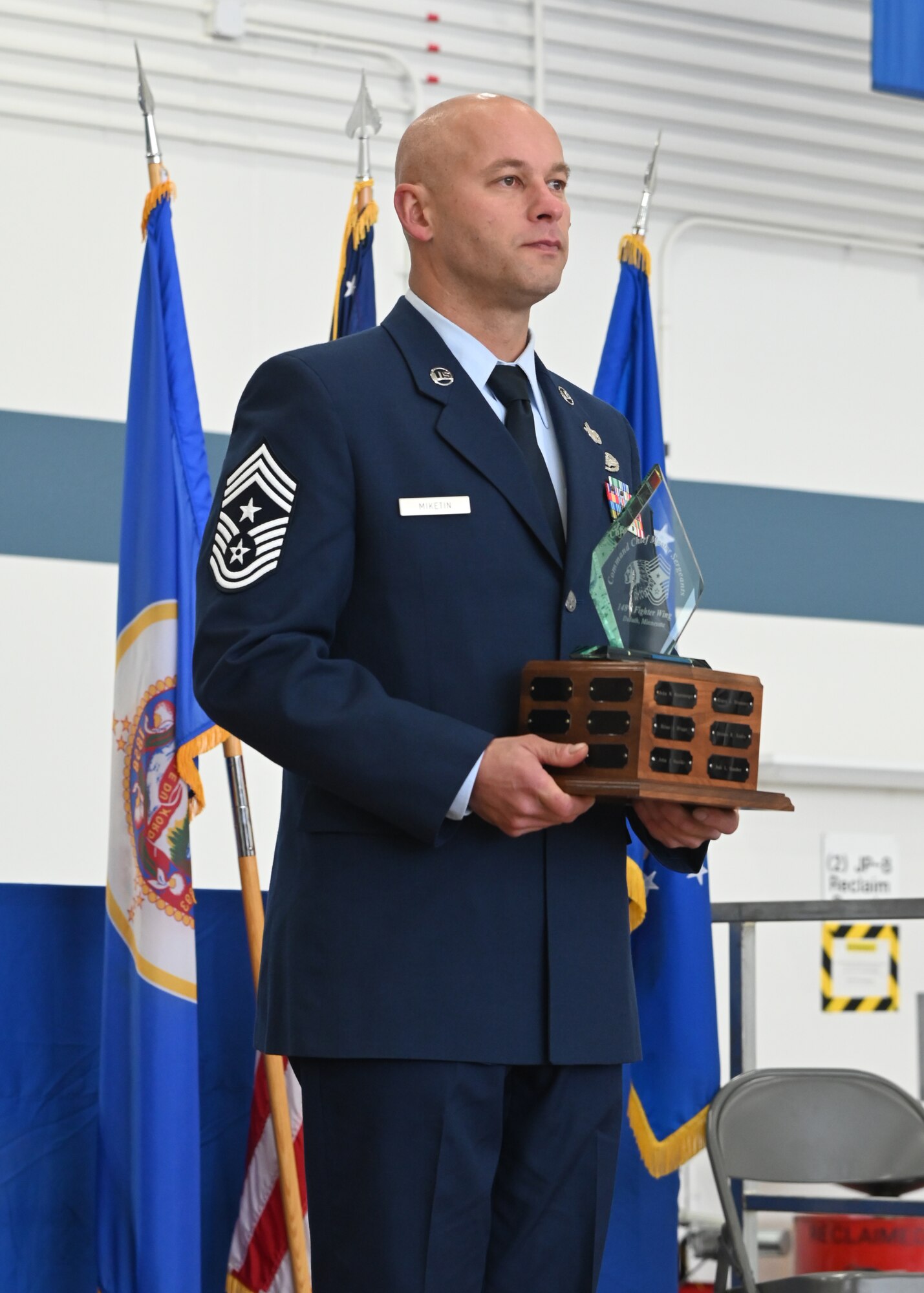 U.S. Air Force Chief Master Sgt. Jozef Mikefin becomes the Command Chief Master Sgt. of the 148th Fighter Wing during a ceremony at the wing, Oct. 15, 2021. He is the tenth individual to hold this position at the 148FW since 1988. U.S. Air National Guard photo by Audra Flanagan.